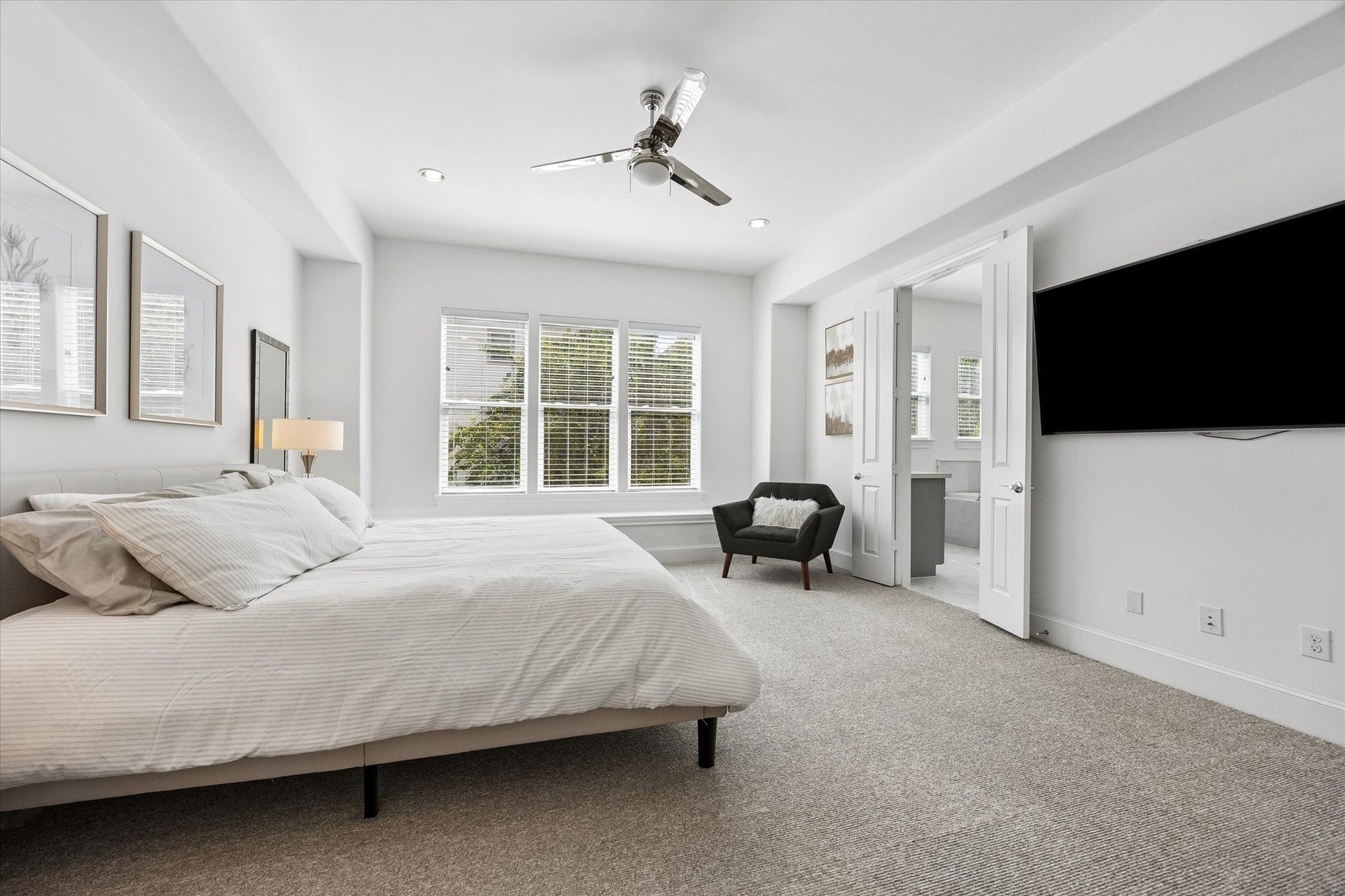 2018 Covent Garden Station, Houston, TX 77045 The oversized Primary Suite features carpet, a wall of windows that bring in plenty of natural light & most importantly TWO massive walk in closets.