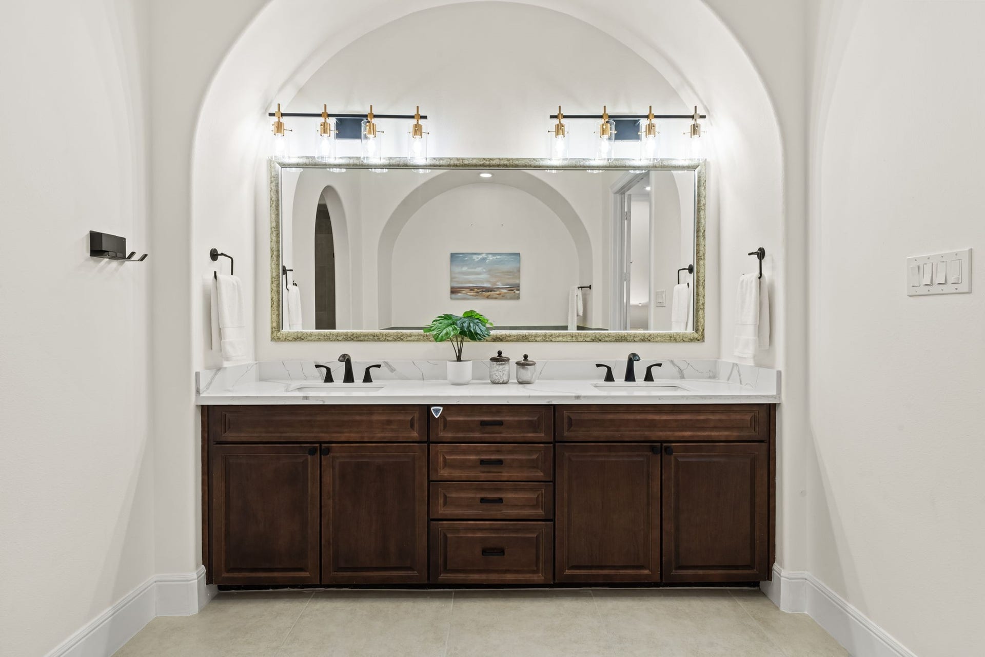 1423 Knox Street, Houston, TX 77007 The primary bath vanity provides generous storage and a broad surface for daily routines. Polished fixtures, framed mirrors, and updated finishes complete the tailored design.