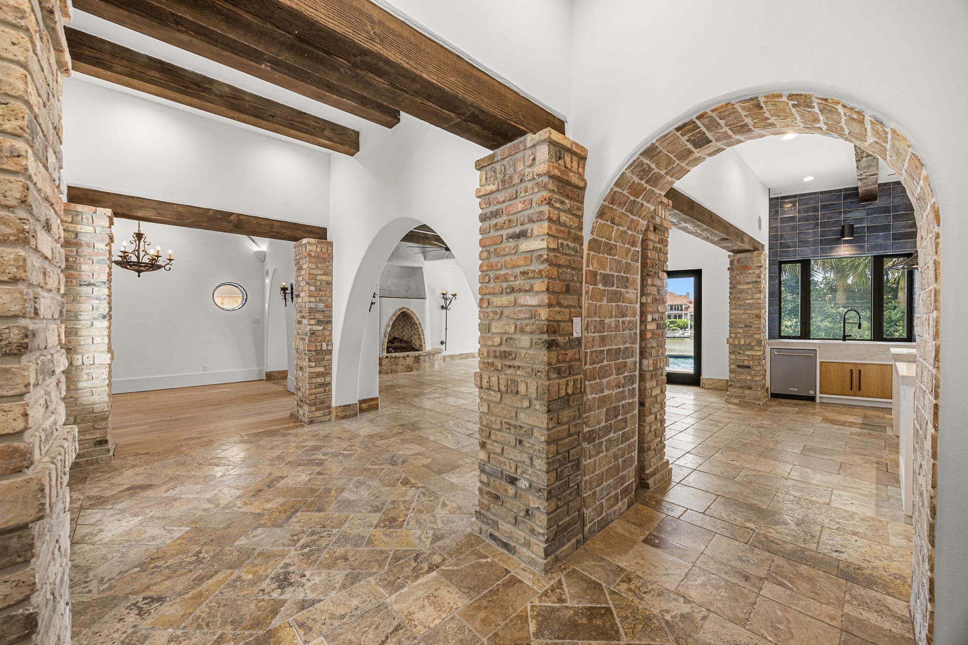 721 Harborside Way, League City, TX 77565 From the hallway, stunning brick details create a dramatic architectural statement, adding texture, character, and old-world charm.