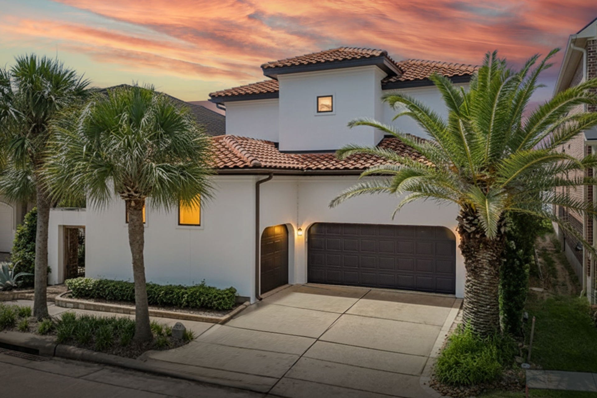 721 Harborside Way, League City, TX 77565 Mediterranean-style stucco home with a classic tile roof and a spacious three-car garage.