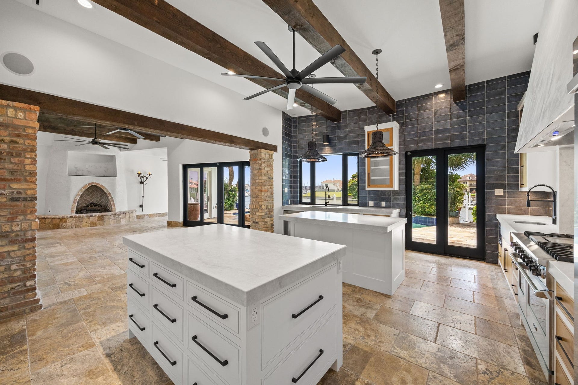 721 Harborside Way, League City, TX 77565 The dual kitchen islands are thoughtfully designed with soft-close drawers throughout, including oversized pot and pan drawers that provide exceptional organization and convenience.