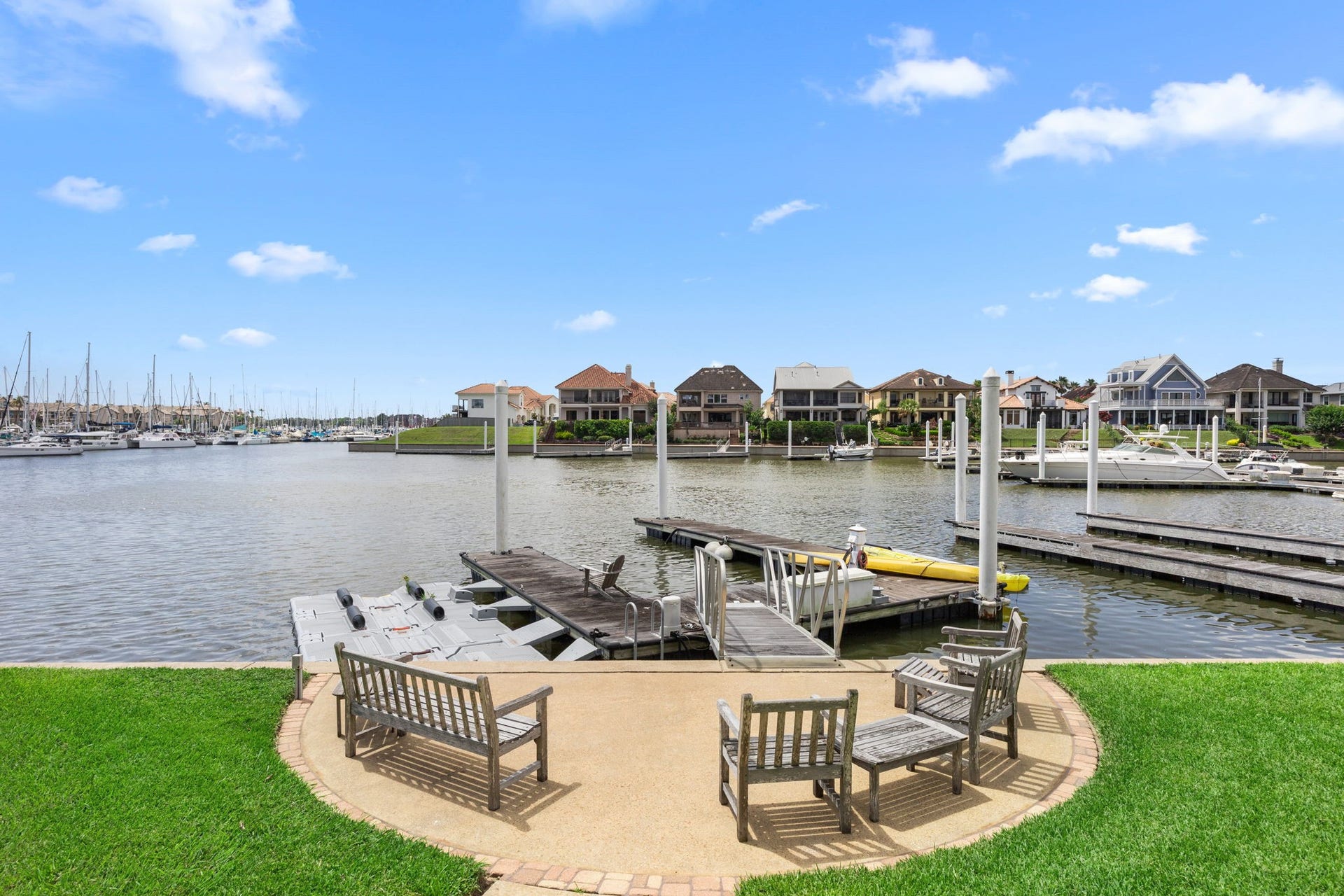 721 Harborside Way, League City, TX 77565 A relaxing sitting area just off the docks provides the perfect spot to enjoy peaceful waterfront views and coastal breezes.