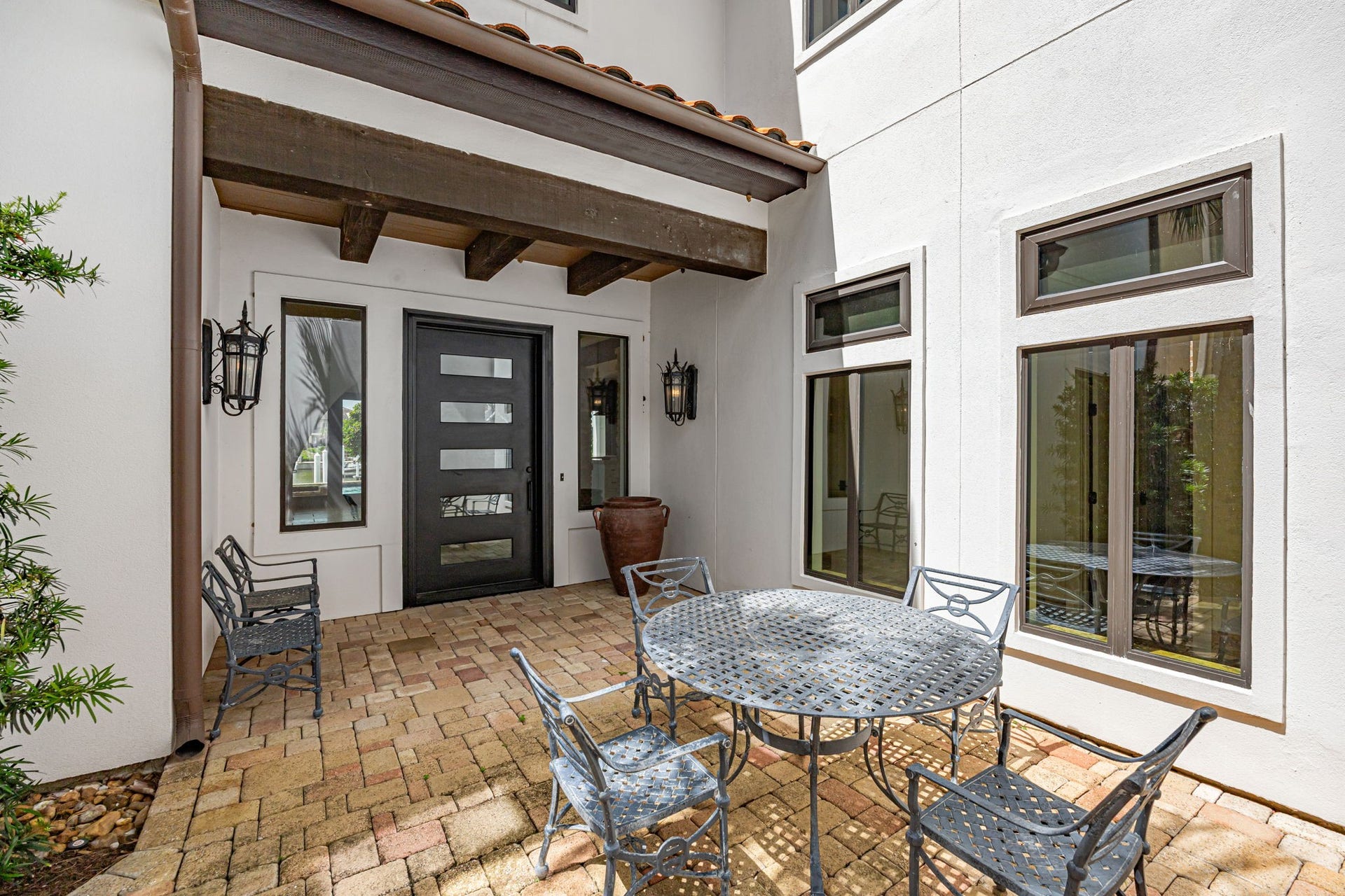 721 Harborside Way, League City, TX 77565 A secure steel entry door opens to a welcoming patio space at the entrance, blending durability with outdoor charm.