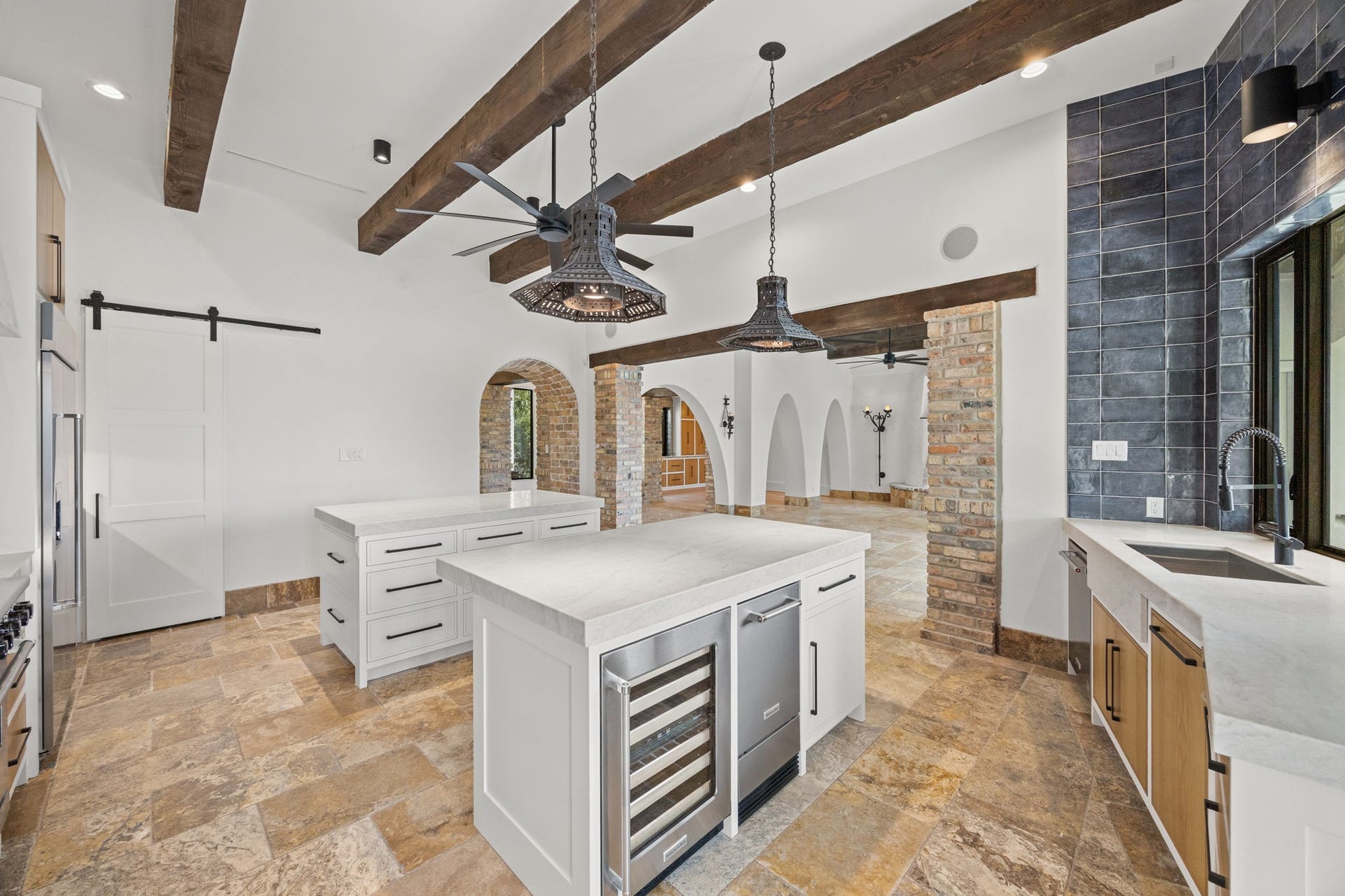 721 Harborside Way, League City, TX 77565 The kitchen is further enhanced by a separate ice maker and beverage cooler, adding convenience and functionality for effortless entertaining.