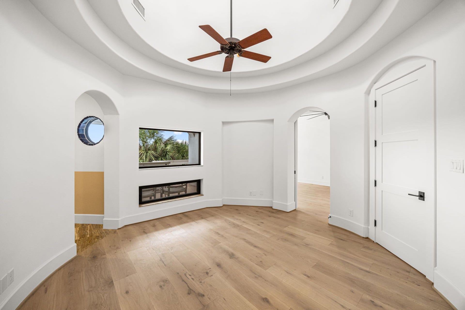 721 Harborside Way, League City, TX 77565 A grand entry leads to the upstairs primary suite, introducing a thoughtful layout of interconnected spaces that could easily serve as a private study. The bedroom and bath are positioned on opposite sides for enhanced privacy.