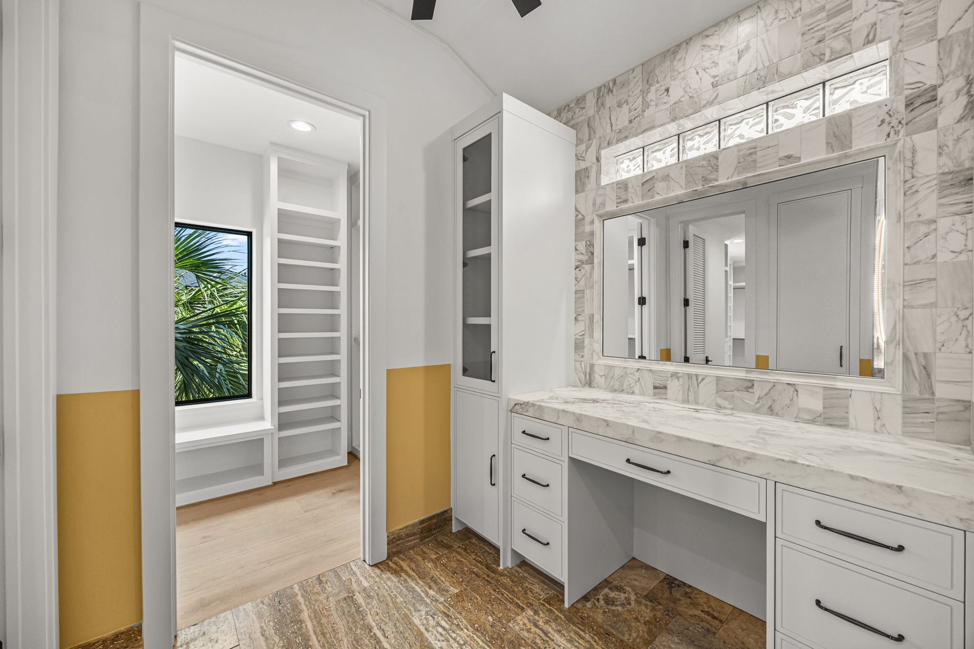 721 Harborside Way, League City, TX 77565 The upstairs primary bath vanity offers a thoughtfully designed layout with views into the second walk-in closet, enhancing convenience and flow.