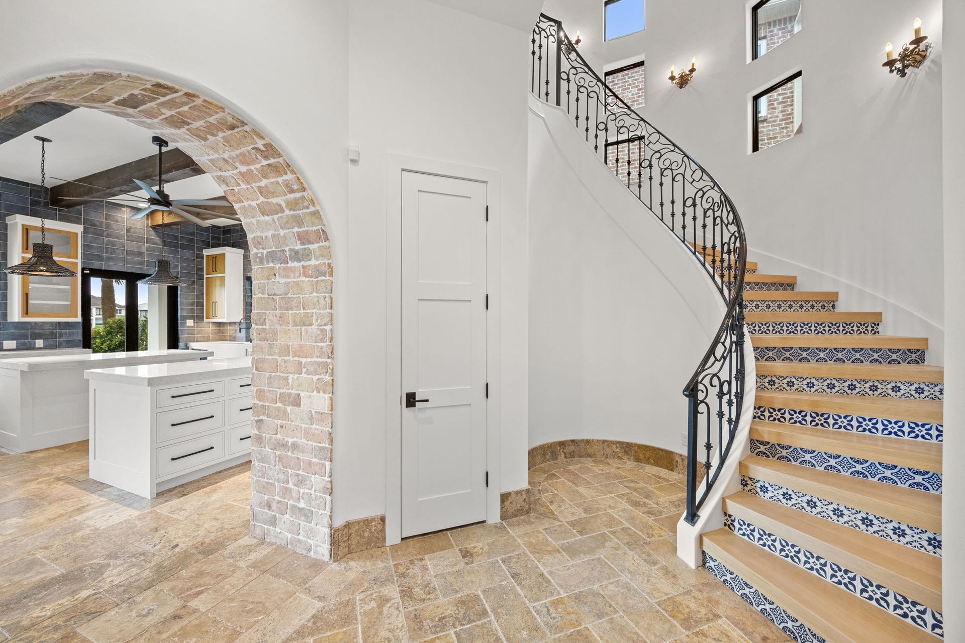 721 Harborside Way, League City, TX 77565 The grand staircase is a true architectural statement, featuring hand-painted Talavera tile accents and solid wood treads that showcase exceptional craftsmanship.