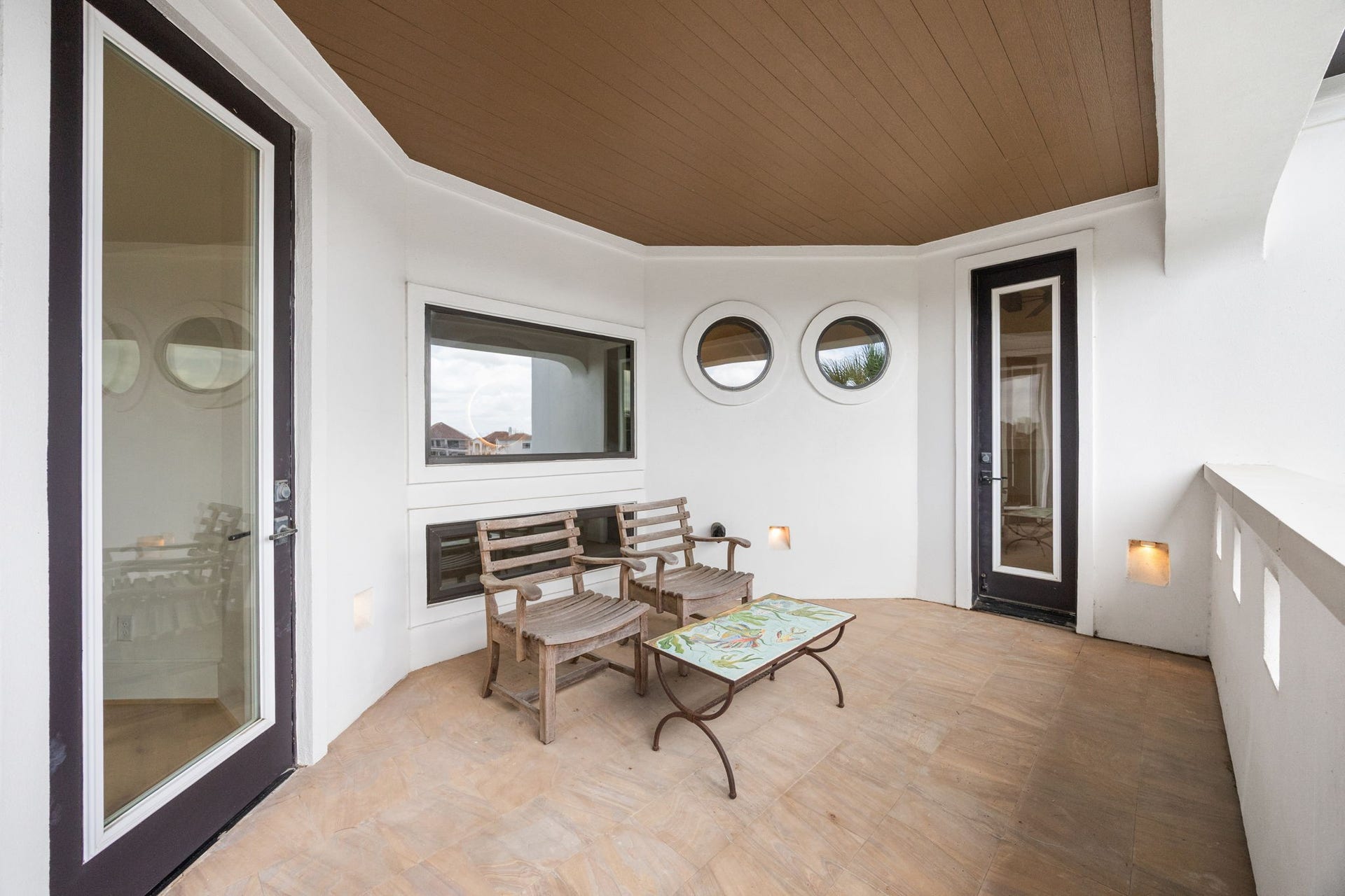 721 Harborside Way, League City, TX 77565 A private balcony extends from both the primary bedroom and flex room, offering seamless indoor-outdoor living and elevated resort-style views.