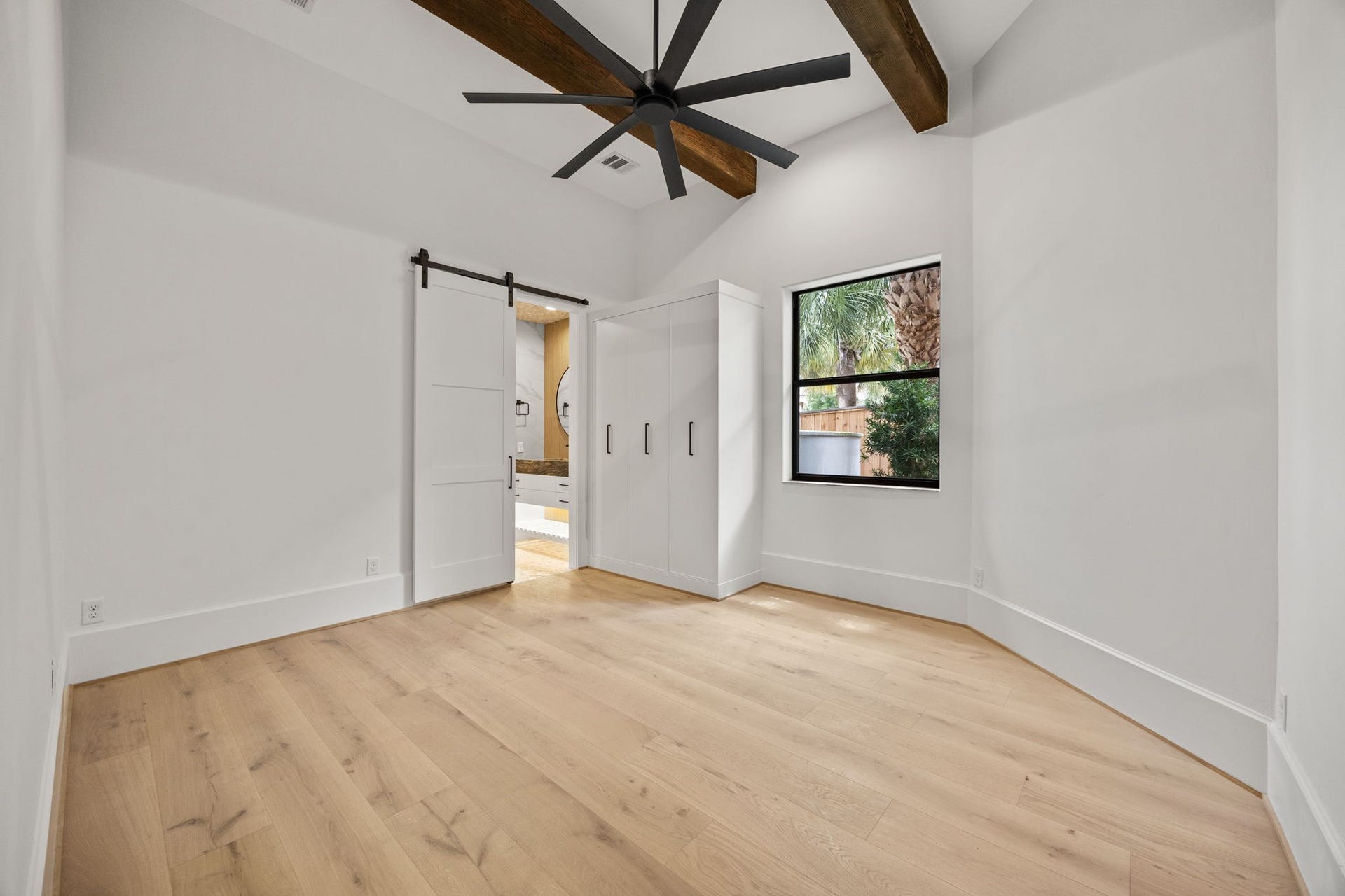 721 Harborside Way, League City, TX 77565 The downstairs primary suite features custom built-in wardrobe cabinetry, offering refined storage and elegant organization.