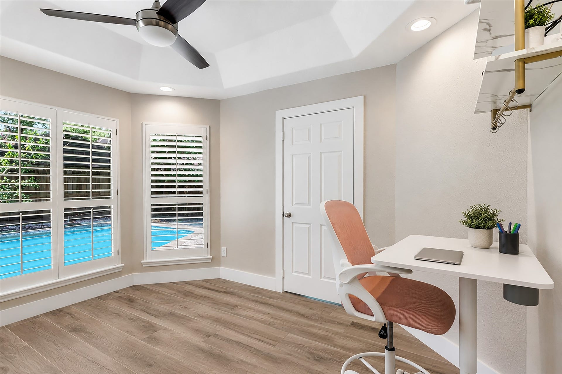 3714 Swift Creek Drive, Kingwood, TX 77339 Bright home office/home/gym gym/nursery with pool views, featuring large windows with shutters, would also make for a great nursery or home gym!