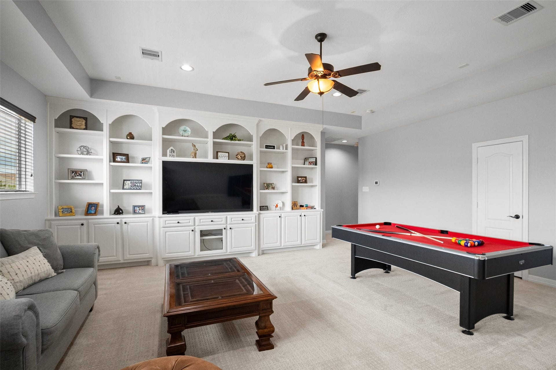 21114 W Kelsey Creek Trail, Cypress, TX 77433 Upstairs game room large enough for a pool table, built-in entertainment center, and a sitting area. Cozy up with a book, watch a movie along with plenty of room for a pool table or another game table of choice.