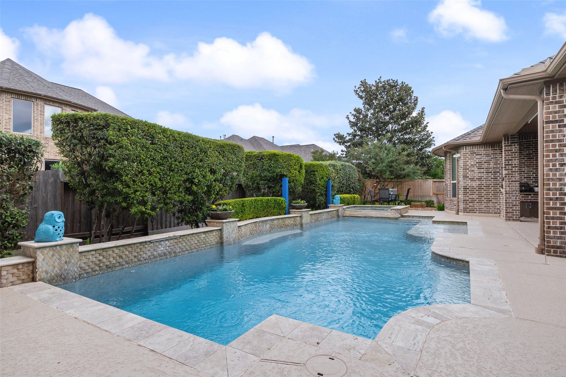 21114 W Kelsey Creek Trail, Cypress, TX 77433 A pool is a great way to make the Texas summers easier to deal with. Notice the blue, short metal posts near the edge of the pool. These posts hold an very nice, custom awning that goes over a portion of the pool to shade those who aren't wanting all the sun exposure, but want to enjoy the water. This was an $8000. addition to the pool that the sellers have really enjoyed.