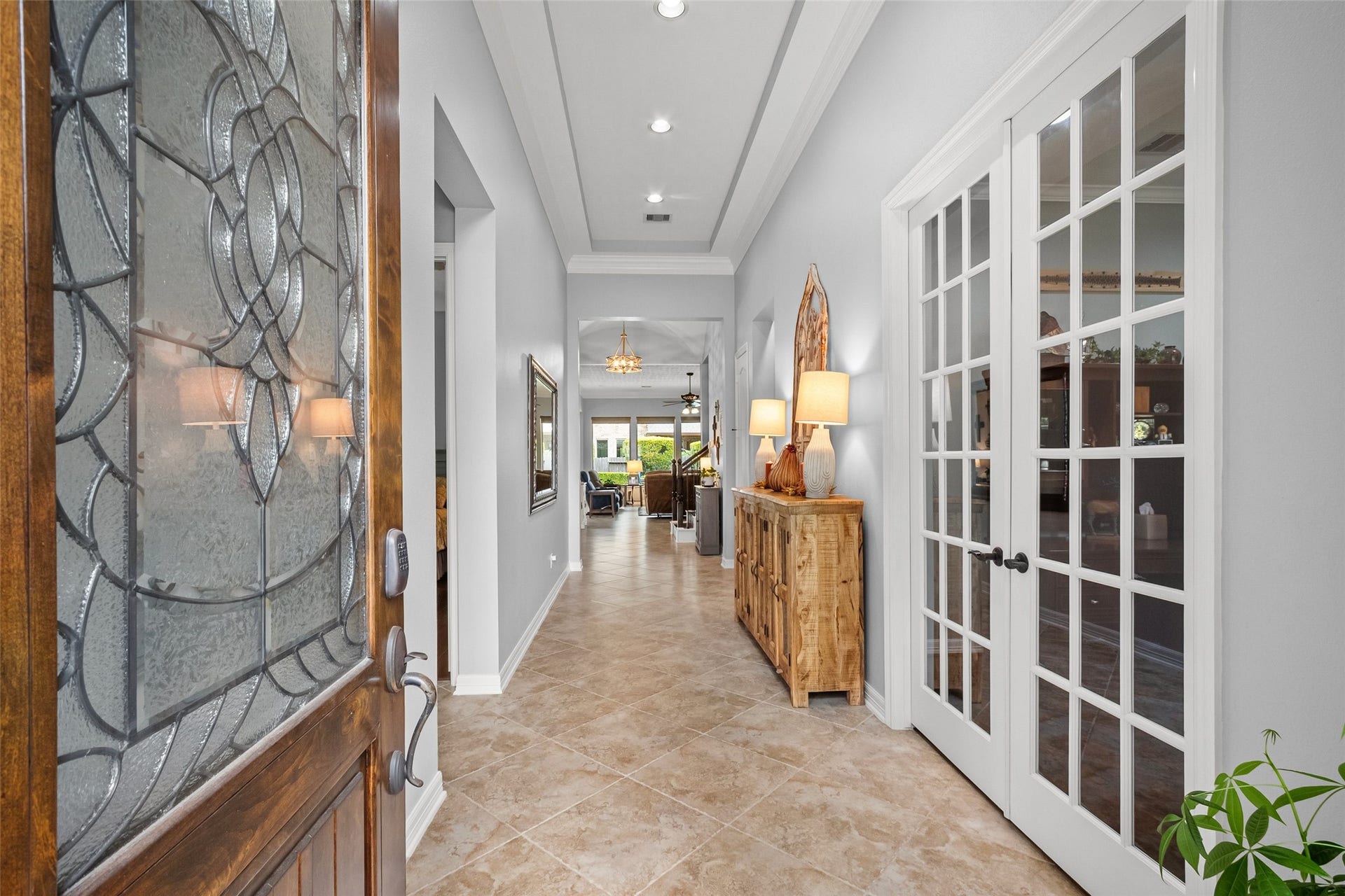 21114 W Kelsey Creek Trail, Cypress, TX 77433 Welcome! Home office/study just inside to the right behind the french doors. Wide entryway then leads to the open living/kitchen/breakfast space that overlooks the backyard.