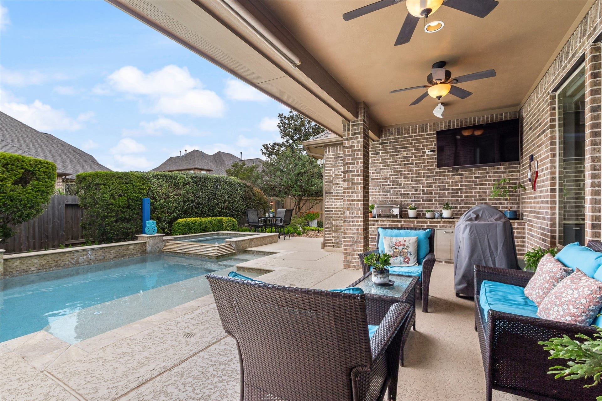 21114 W Kelsey Creek Trail, Cypress, TX 77433 Watch the swimmers from the patio, or enjoy a visit with family & friends. This covered patio has a counter for a tabletop grill & a built-in refrigerator. This would be a great spot for a tabletop griddle as well. (The small grill seen in pic isn't built-in, and doesn't stay with the home).