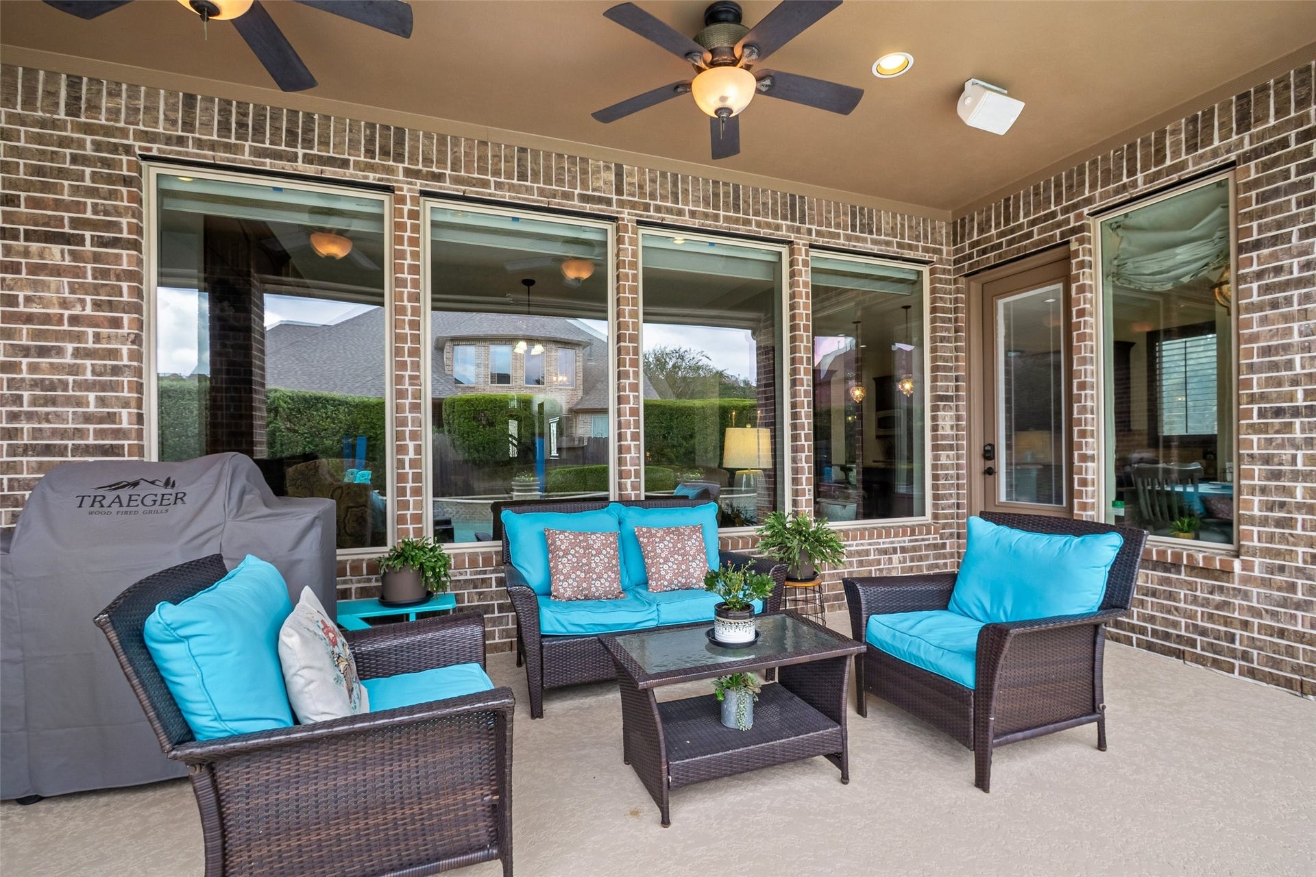 21114 W Kelsey Creek Trail, Cypress, TX 77433 Step outside to this cozy space to enjoy some tv or just to relax.