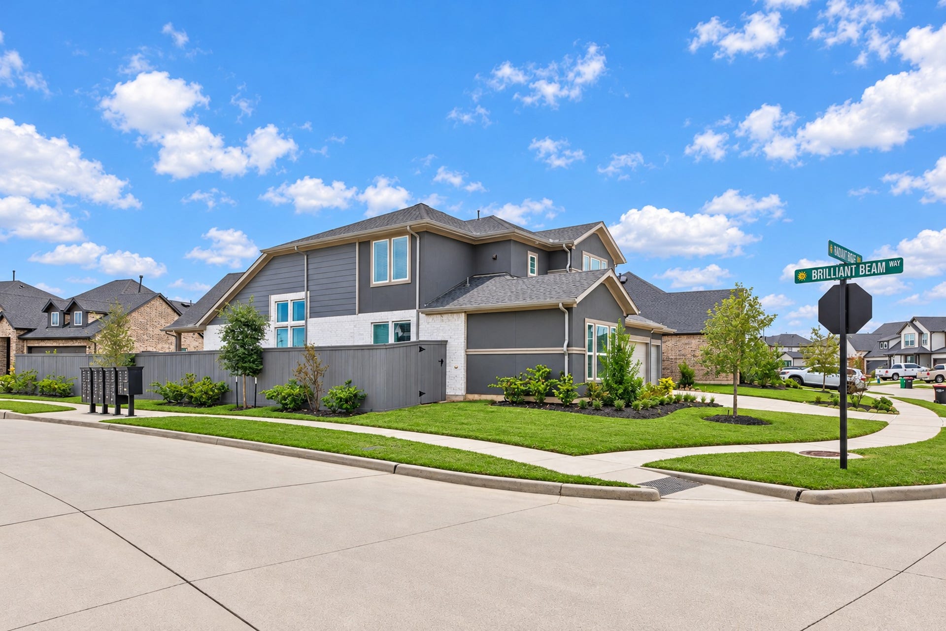 16922 Warm Glow Court, Hockley, TX 77447 Stylish modern home on a corner lot with lush landscaping, spacious sidewalks, and a striking exterior in a well-maintained neighborhood.