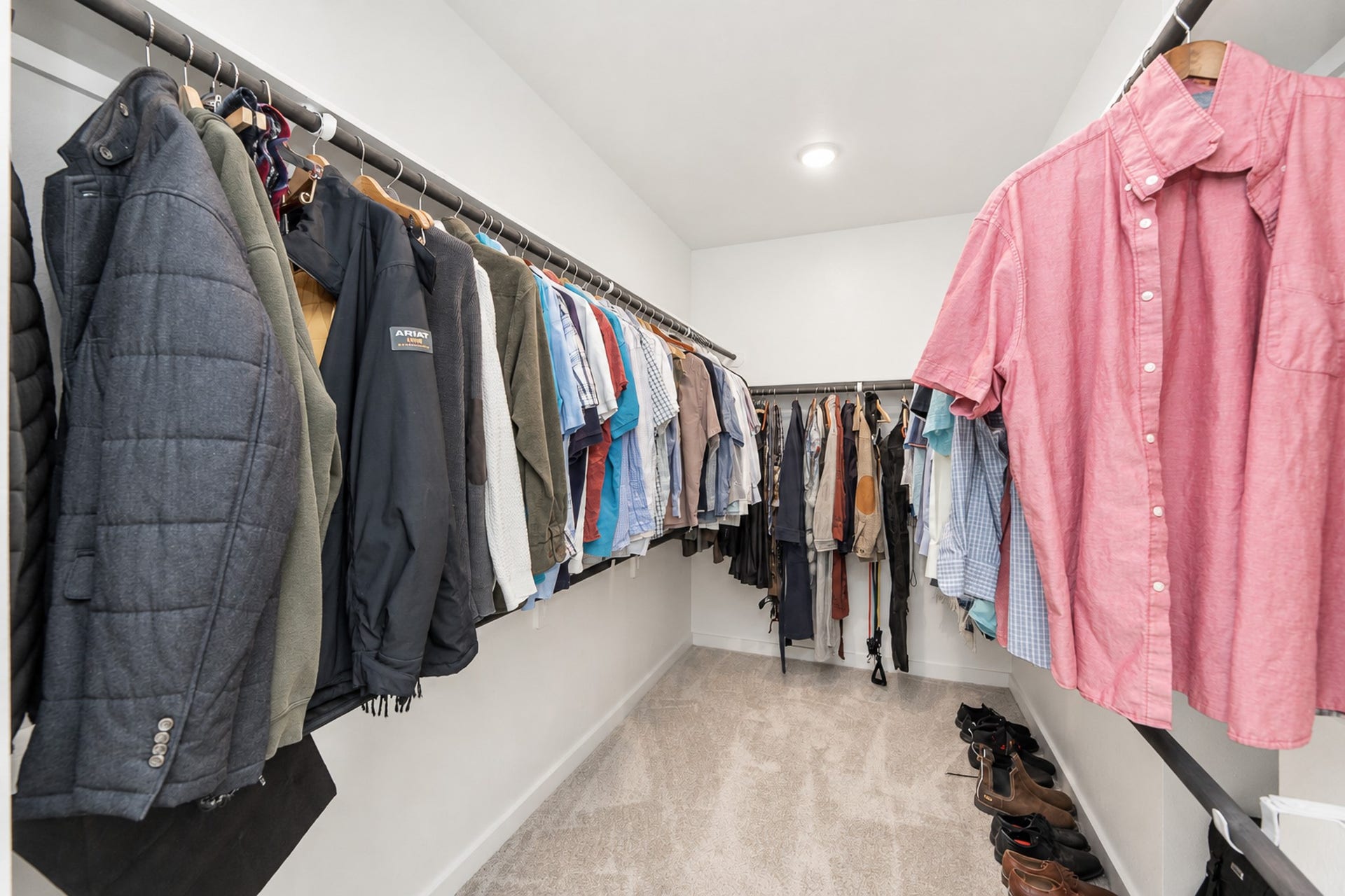 16922 Warm Glow Court, Hockley, TX 77447 Spacious walk-in closet with ample hanging space and neatly organized shelving, perfect for all your wardrobe needs.