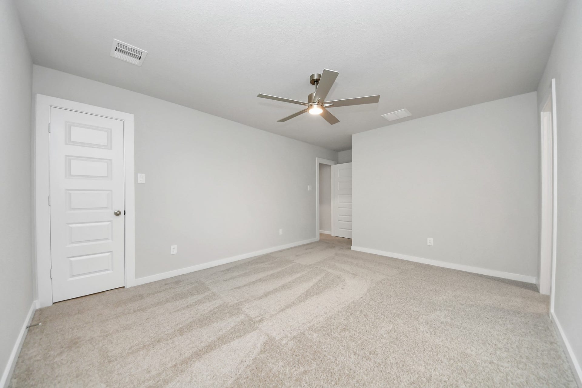11103 Tulip Ridge Trail, Houston, TX 77044 Generously sized secondary bedrooms featuring spacious closets, soft and inviting carpeting underfoot, large windows allowing plenty of natural light, and the added touch of privacy blinds for your personal retreat. Sample photo of completed home with similar floor plan. Actual colors and selections may vary.