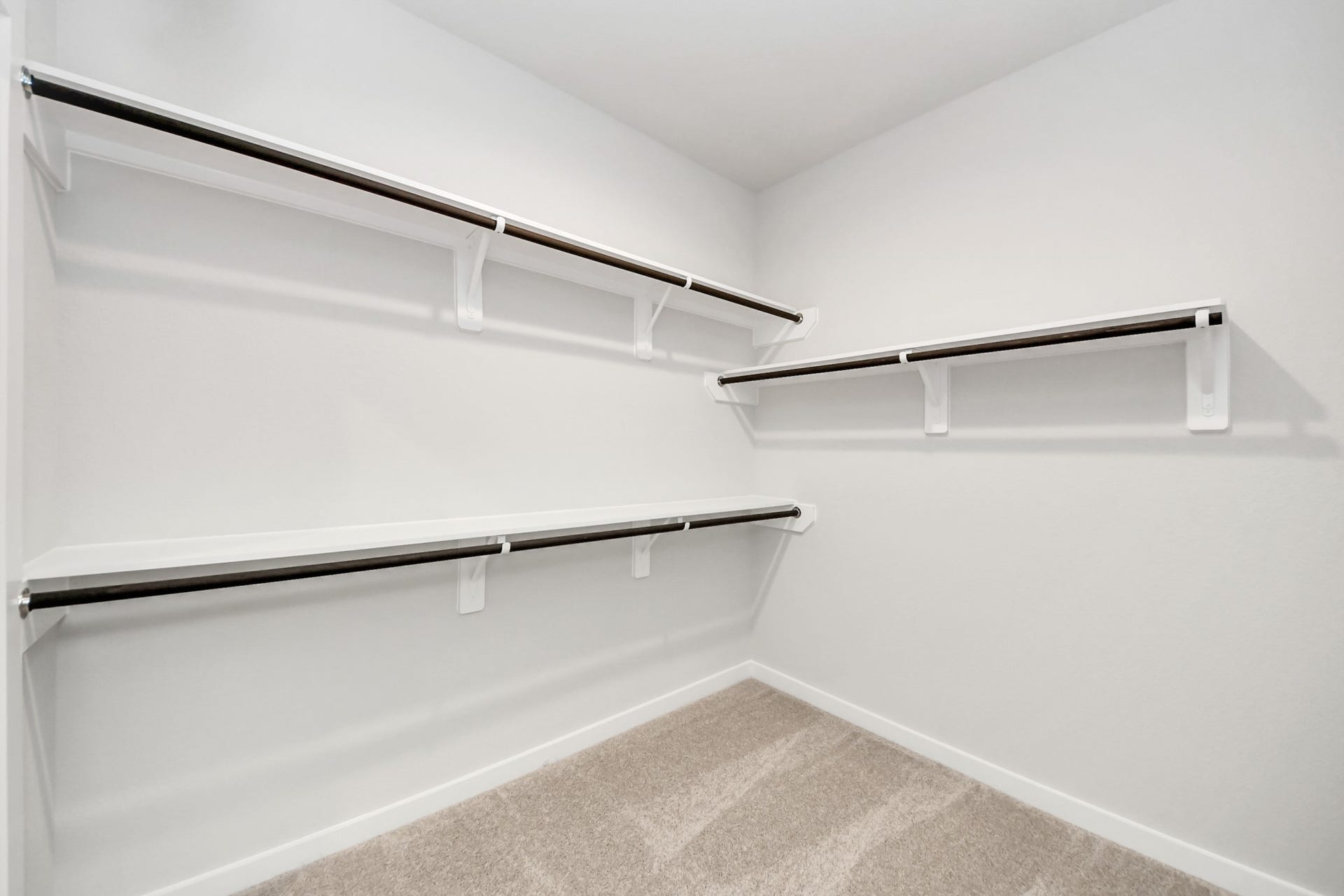 11103 Tulip Ridge Trail, Houston, TX 77044 Walk-in closet that epitomizes luxury and practicality. This generously sized space features built-in shelving, offering abundant room for impeccable organization. High ceilings and recessed lighting create a bright and welcoming ambiance. Sample photo of completed home with similar floor plan. Actual colors and selections may vary.