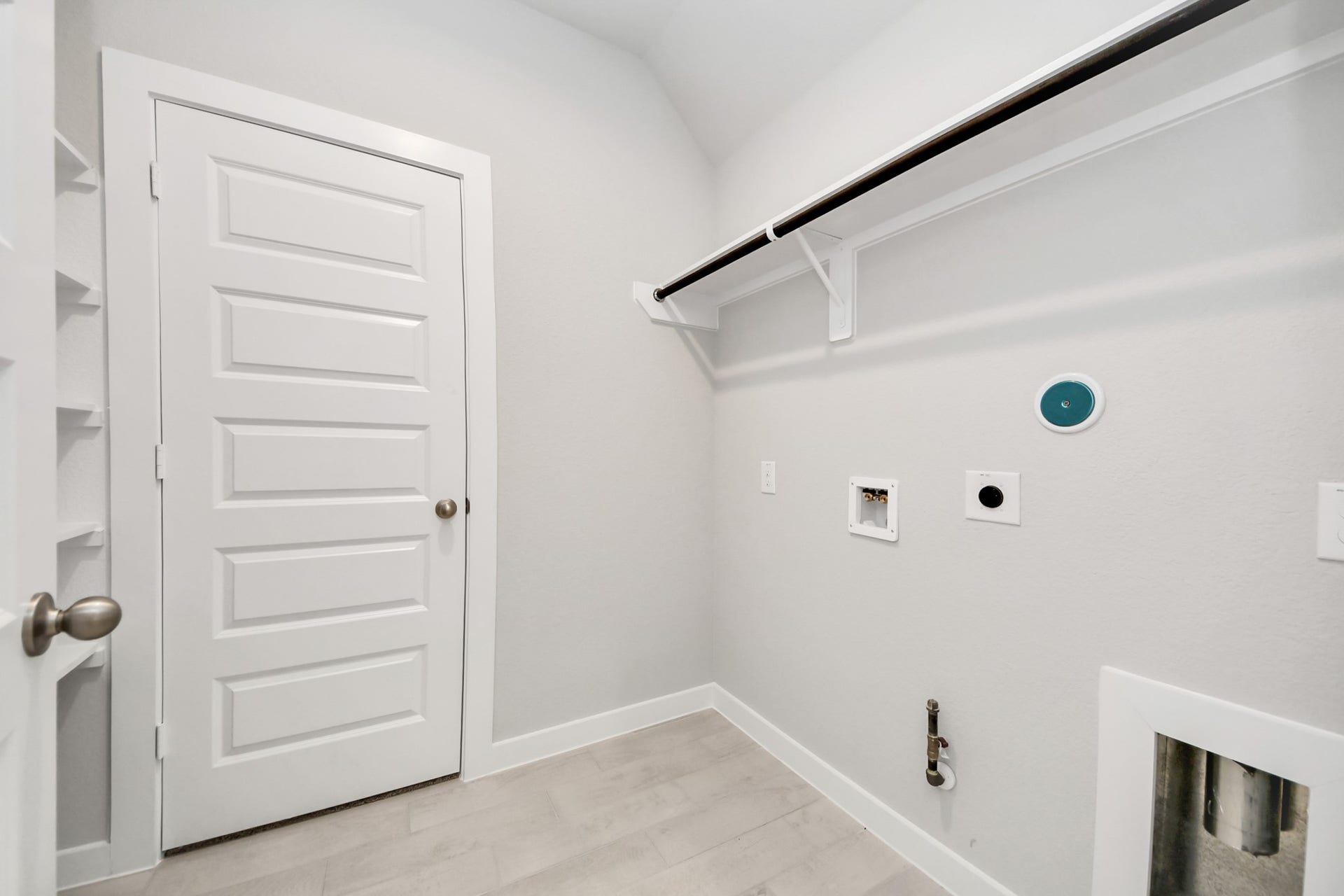 11103 Tulip Ridge Trail, Houston, TX 77044 A perfect blend of functionality and comfort. Capture the essence of easy living with a first-floor laundry room, thoughtfully equipped with shelving for effortless organization. Both electric and gas connections available. Sample photo of completed home with similar floor plan. Actual colors and selections may vary.