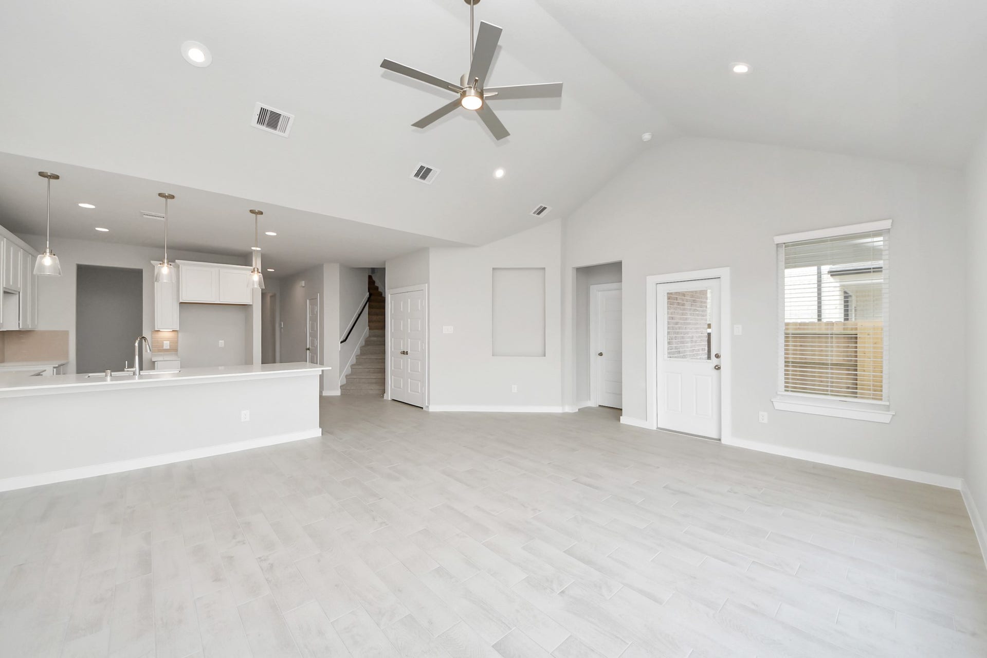 11103 Tulip Ridge Trail, Houston, TX 77044 Take another glimpse into the heart of the home with this additional view of the family rooma sprawling space ready to accommodate all your gatherings. Sample photo of completed home with similar floor plan. Actual colors and selections may vary.