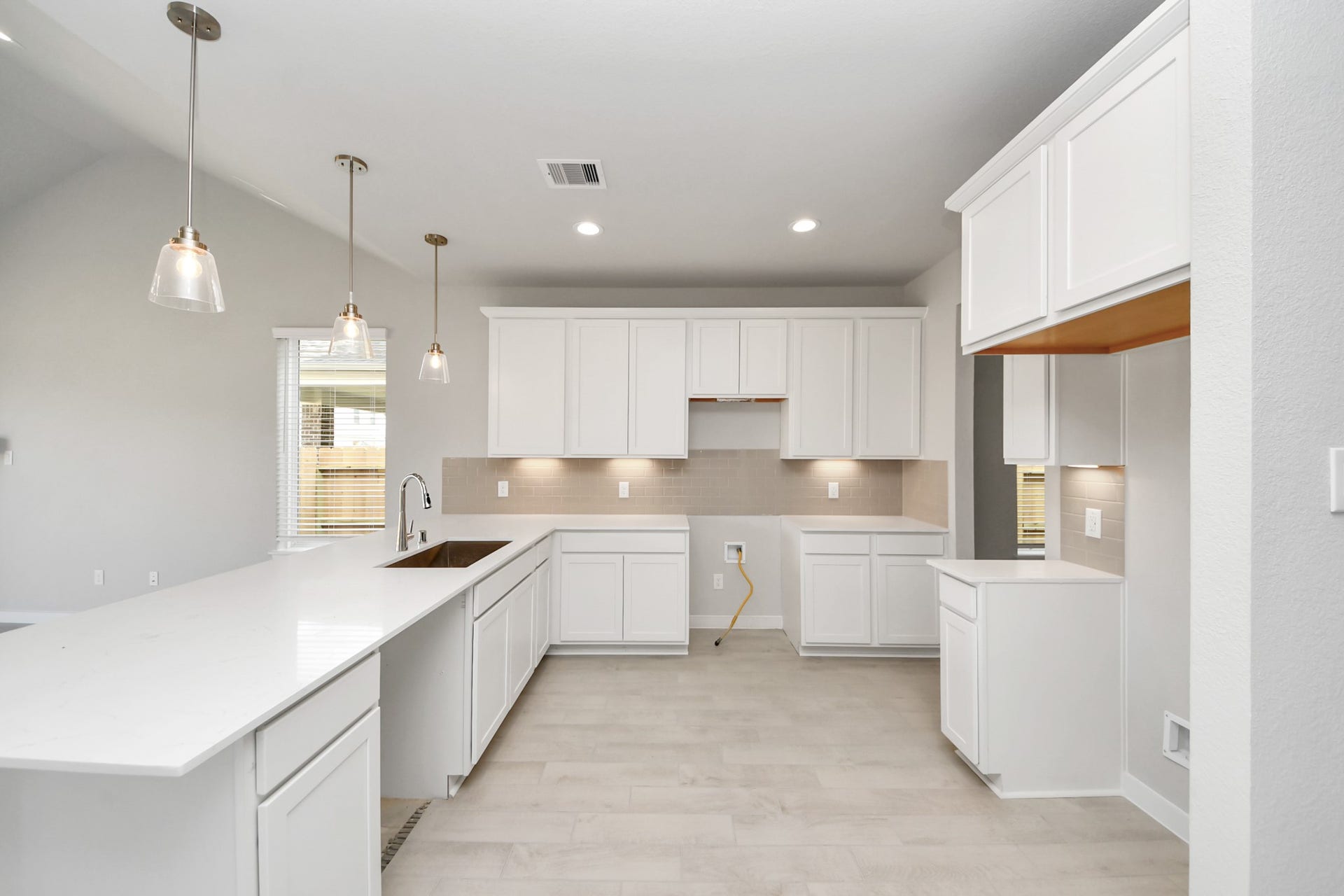 11103 Tulip Ridge Trail, Houston, TX 77044 The kitchen is a culinary haven, featuring granite countertops, a tile backsplash, stainless steel appliances, 42 upper cabinets, and undercabinet lighting. Sample photo of completed home with similar floor plan. Actual colors and selections may vary.