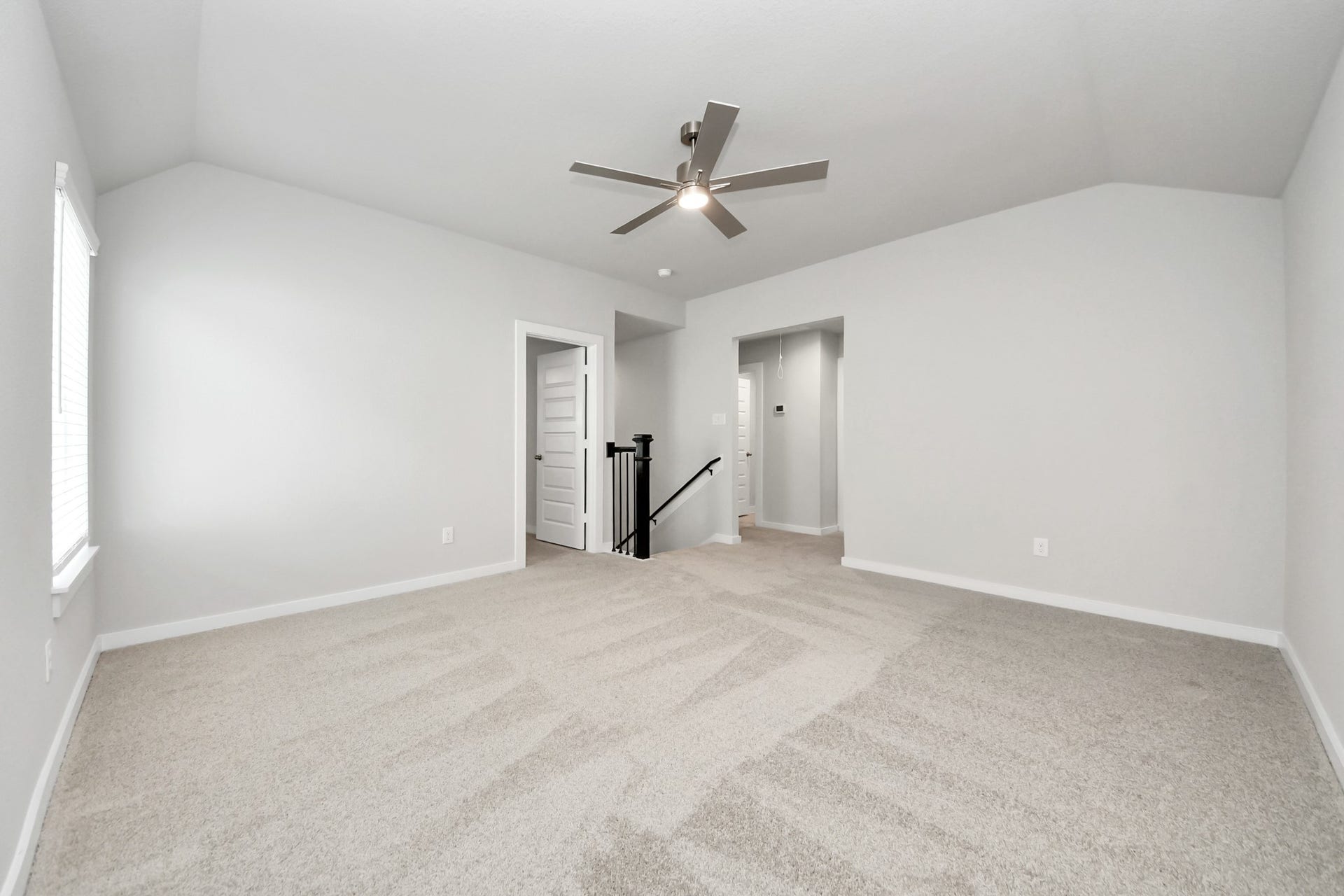 11103 Tulip Ridge Trail, Houston, TX 77044 Ascend to relaxation in this fantastic game room! Ideal for both casual gatherings and adult gaming, it boasts plush carpet, lofty ceilings, custom paint, and ample windows for abundant natural light. Sample photo of completed home with similar floor plan. Actual colors and selections may vary.