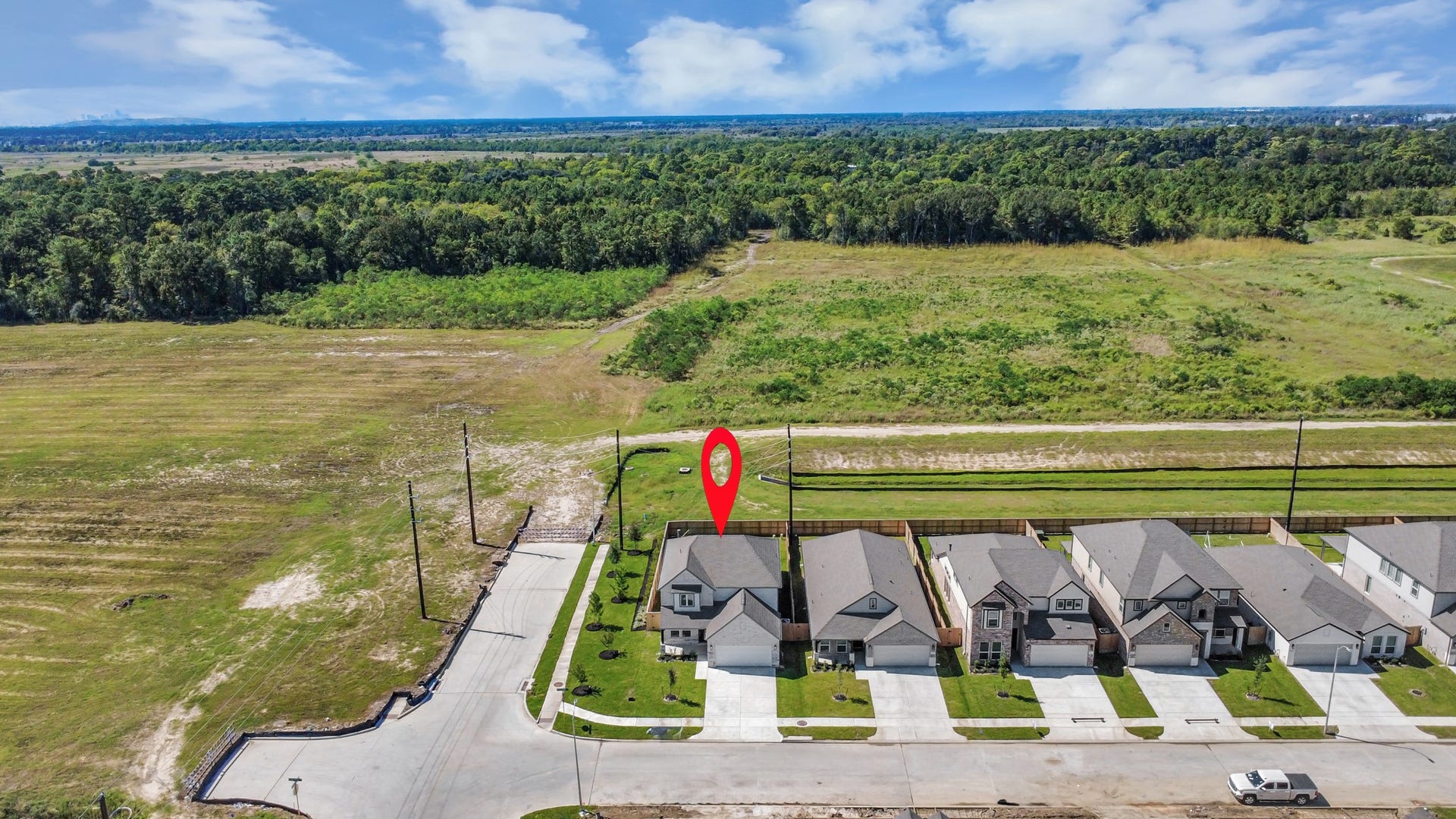 11103 Tulip Ridge Trail, Houston, TX 77044 An aerial view of a spacious subdivision lot, highlighting a well-maintained yard and a fully fenced perimeter, offering both privacy and expansive outdoor space.