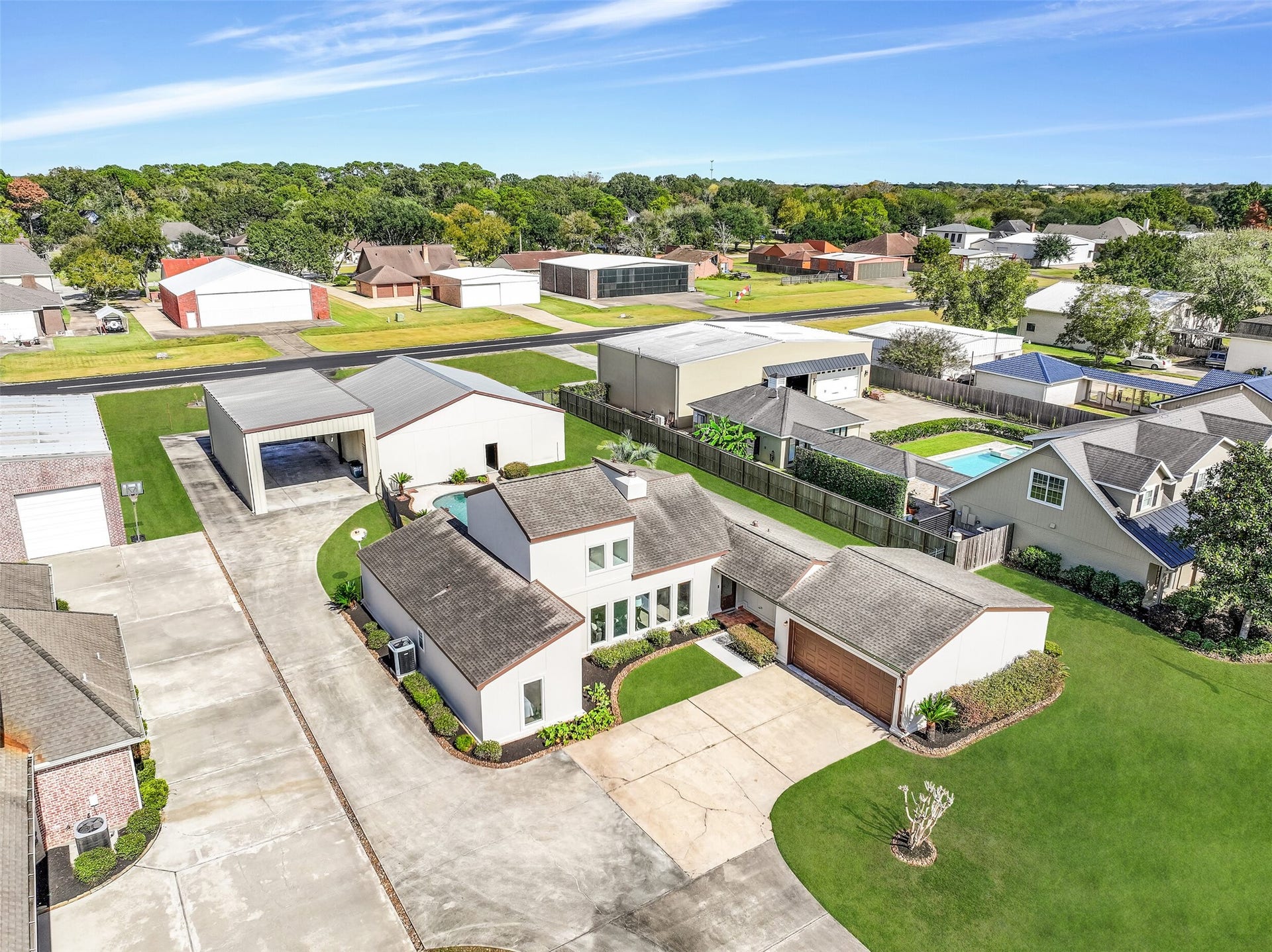 Rare aviation property in Friendswood's Polly Ranch Estates! This 3-bedroom, 2-bath home with a pool features a private 48'x43' airplane hangar, adjoining RV garage & direct taxiway access to the community's 3,070' asphalt runway. A unique opportunity for aviation enthusiasts!