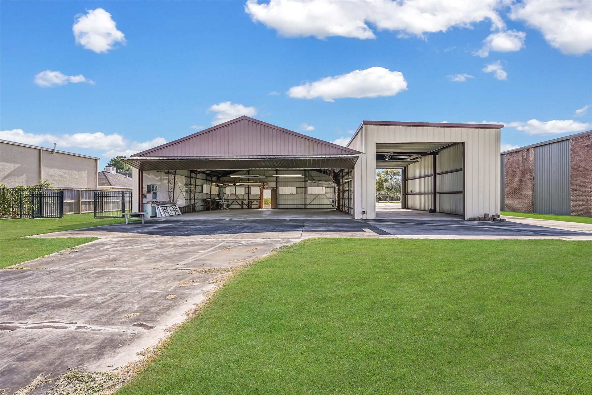 Aviation enthusiasts will appreciate the private 48'x43' airplane hangar with direct taxiway access to Polly Ranch's 3,070' asphalt runway! An adjoining 24'x47' RV garage features front & rear overhead doors, with a separate driveway providing convenient access to both buildings.