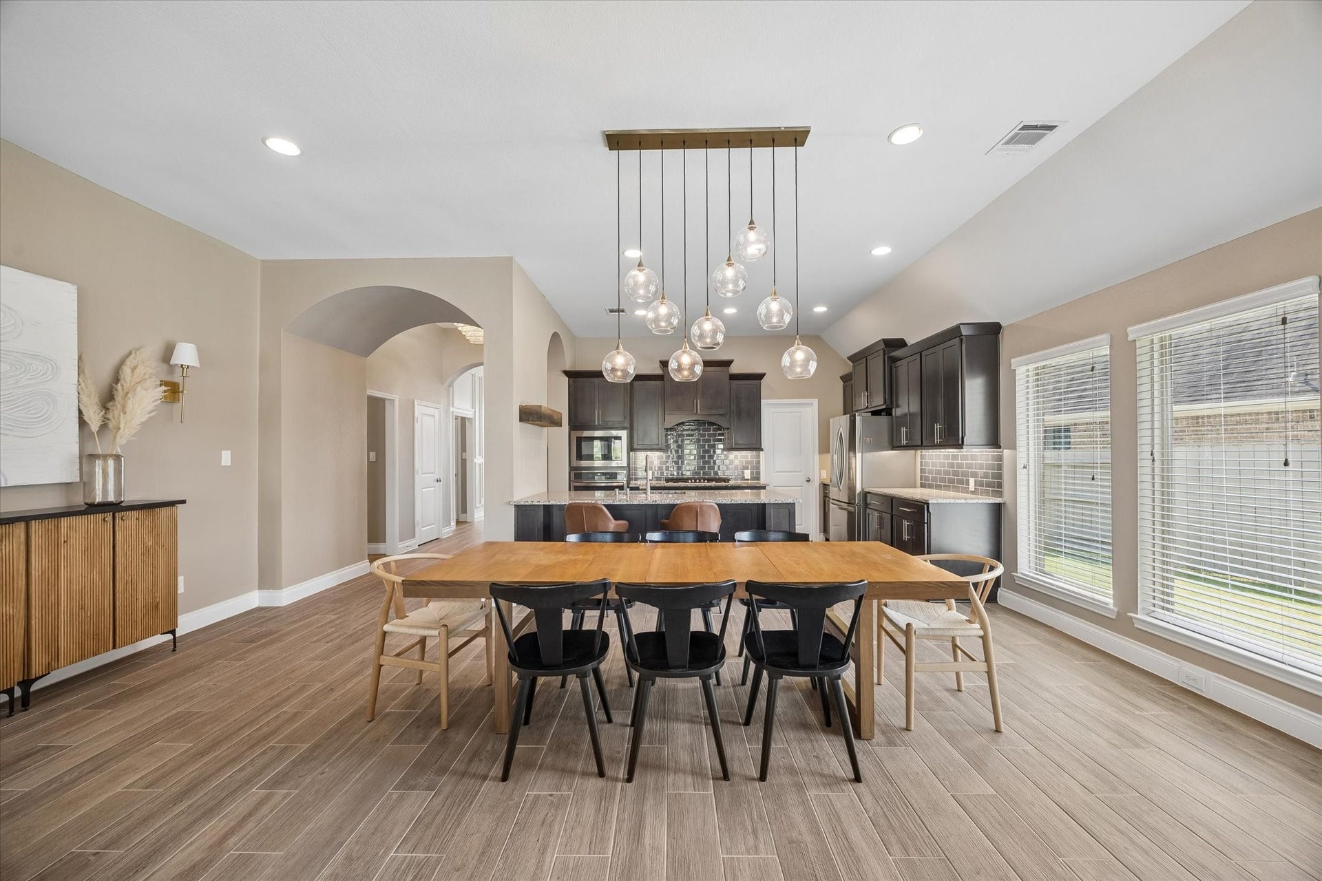 The dining area is spacious and part of the natural flow of the home.