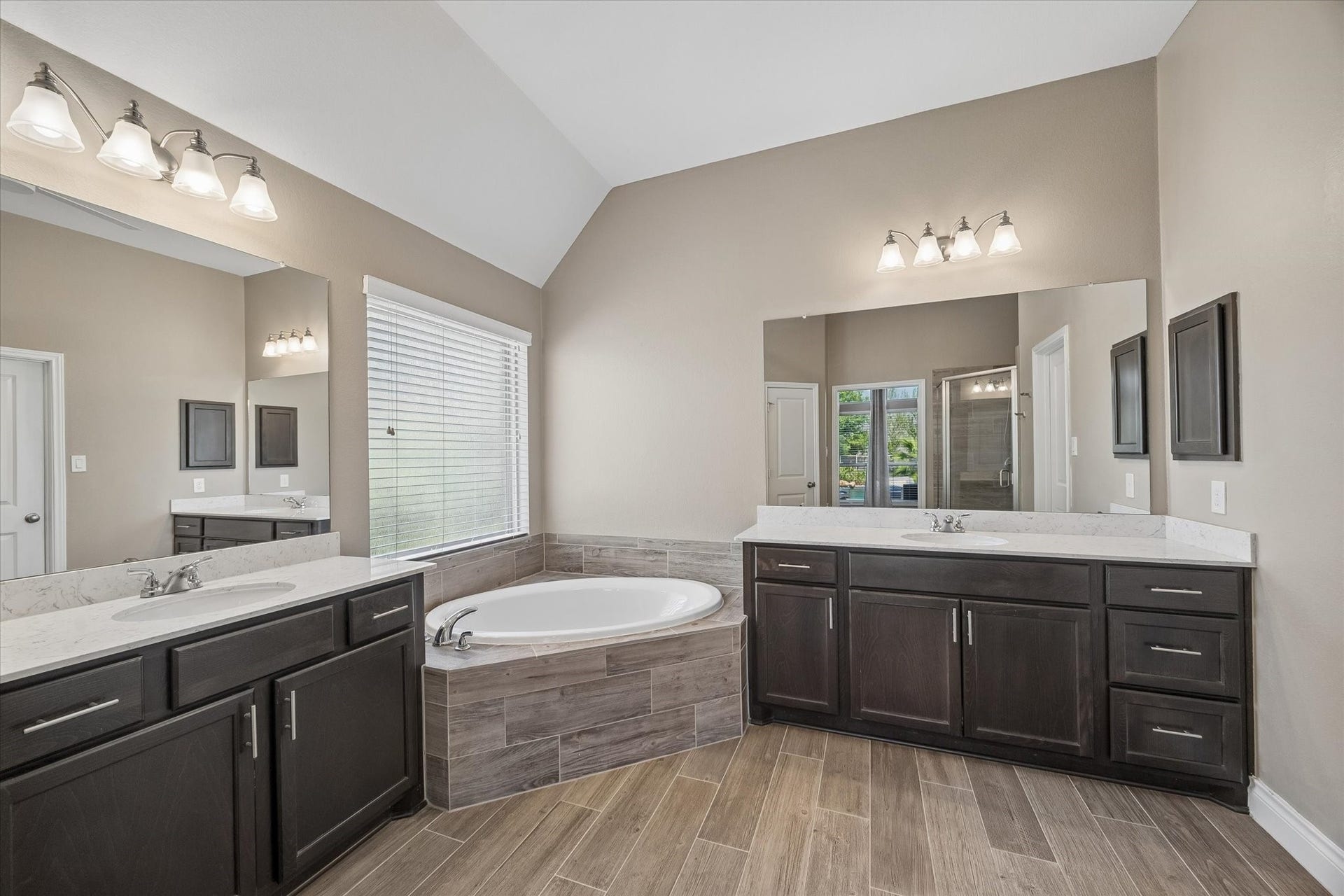 Beautiful split sinks with a large tub. Not pictured is the massive walk-in closet and the separate shower.