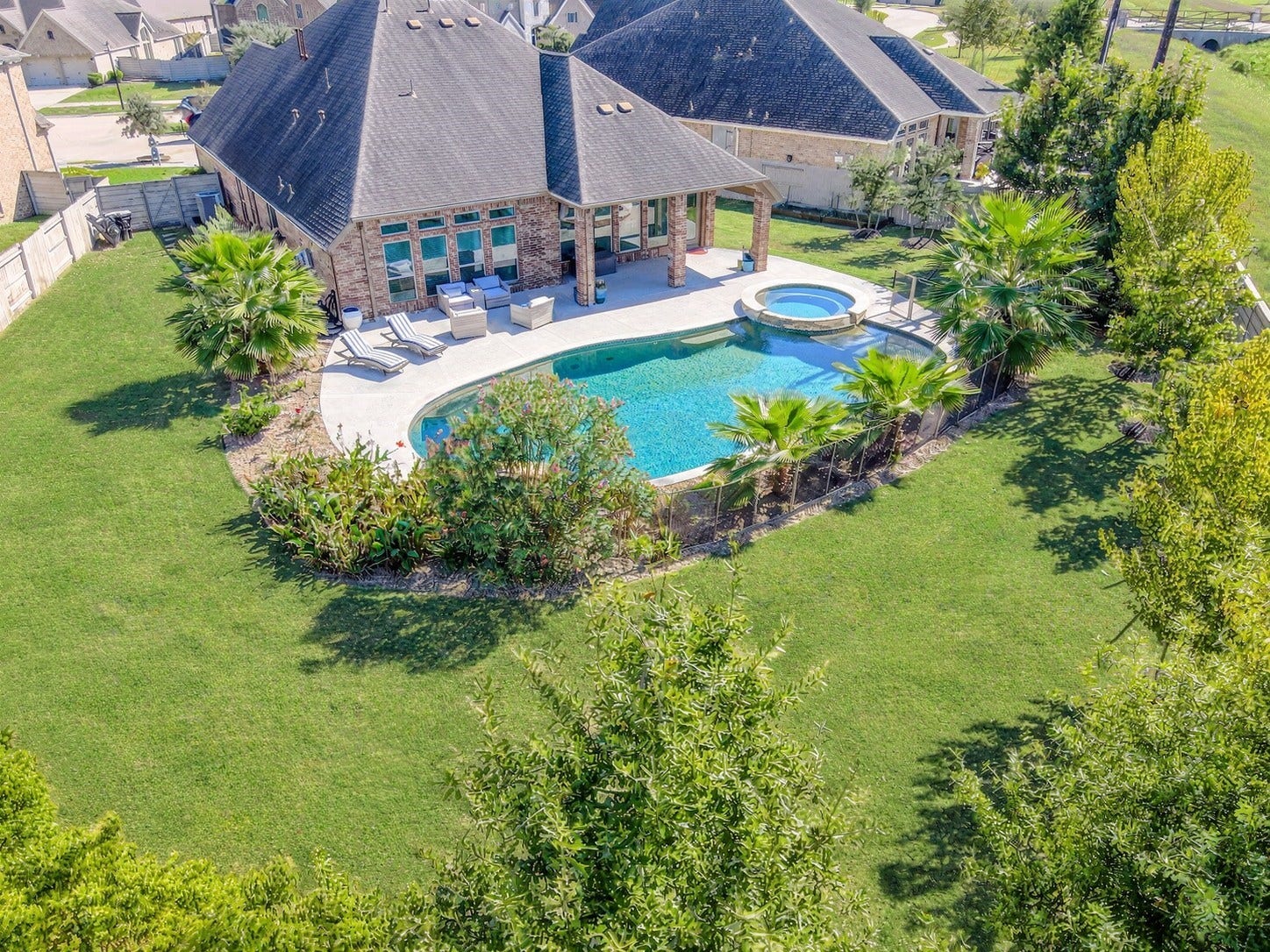 Welcome to your backyard oasis: a Texas-sized pool in a large lot with no back neighbors. If privacy and vacation vibes are what you're looking for, look no further. This custom backyard offers so many thoughtful updates, including the covered patio, cool deck, landscaping for ultimate privacy and so much more!