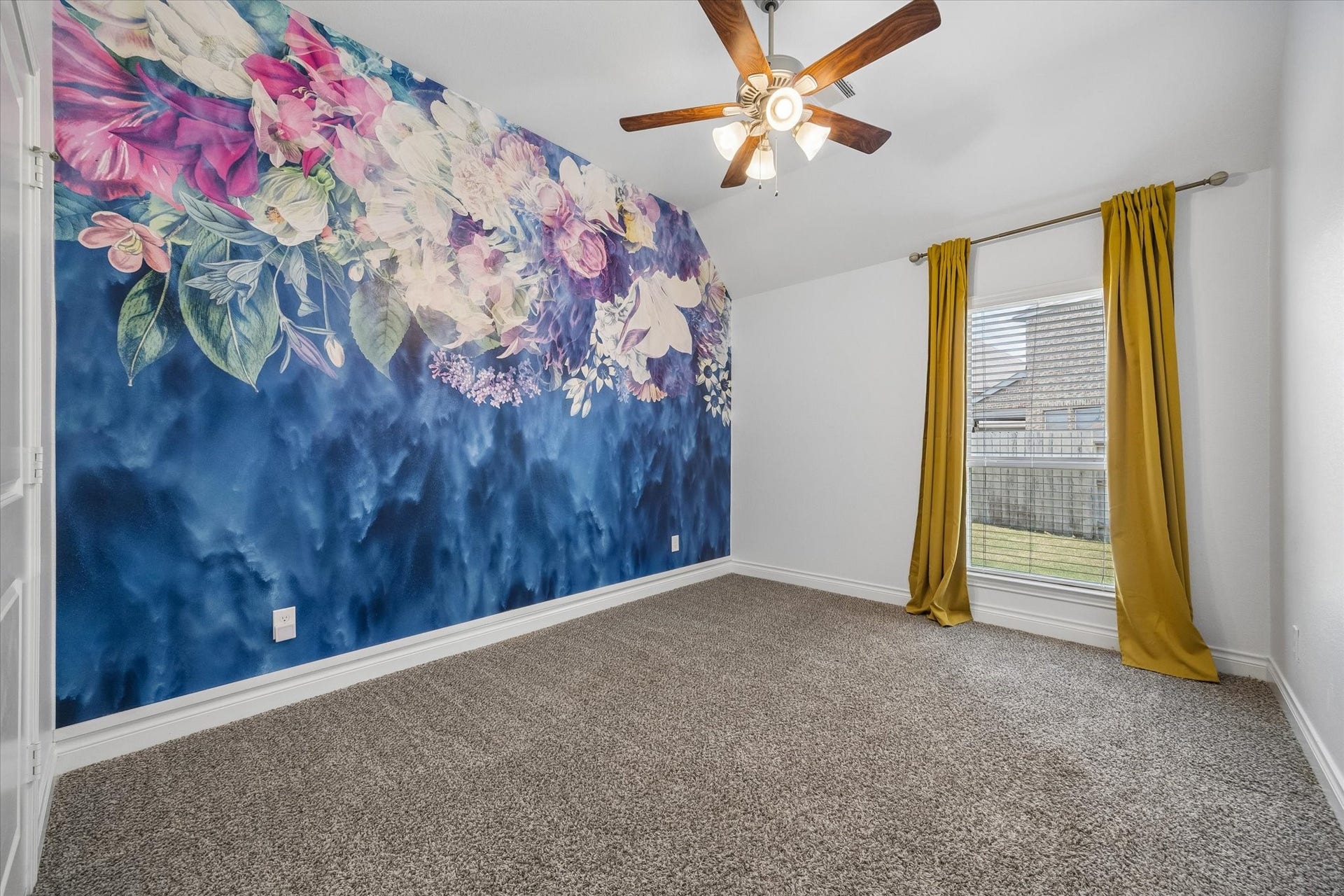 The first of three secondary rooms has a beautiful mural on the wall that can stay or be removed.