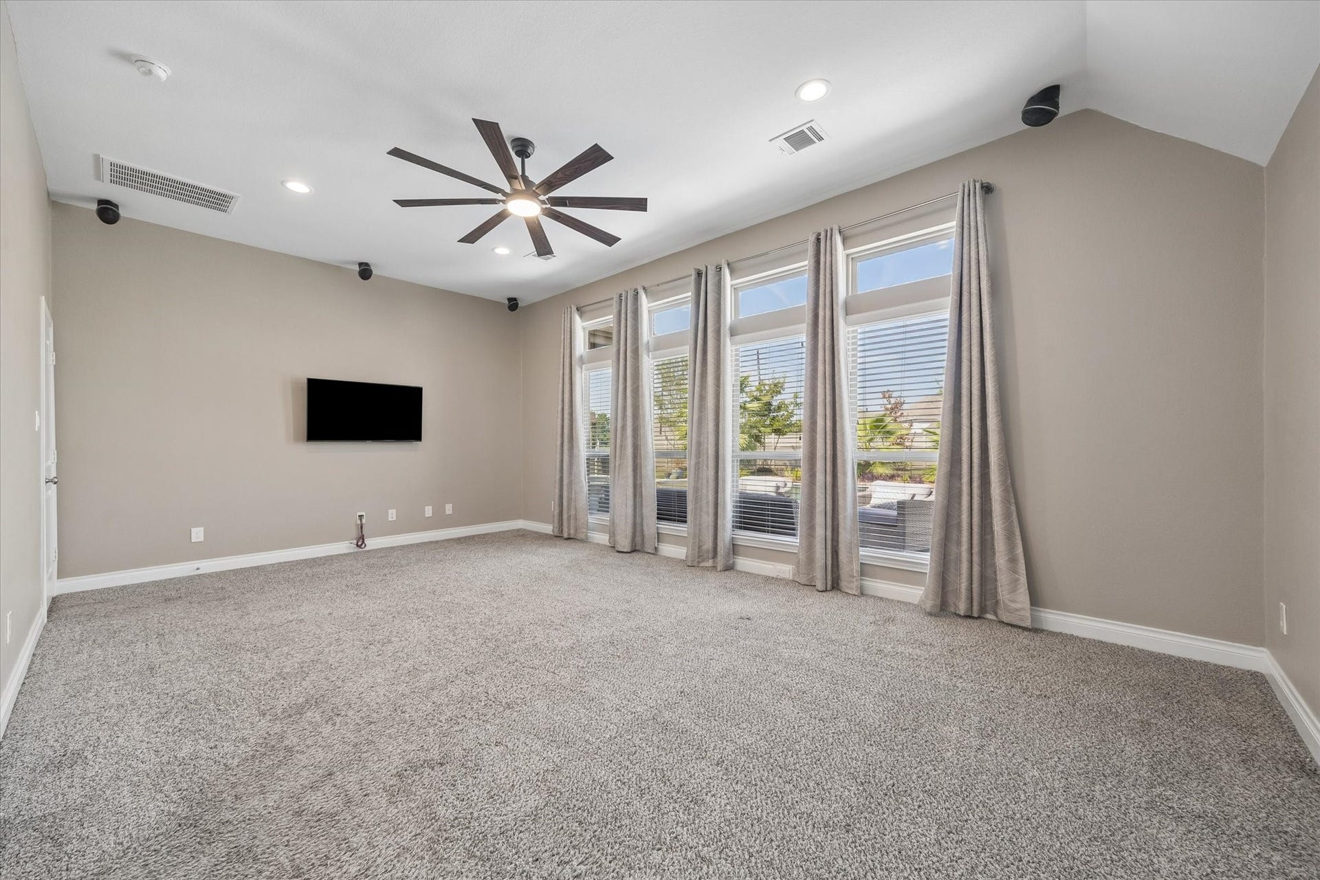 The primary bedroom is huge. The curtains are wonderful at closing out the light from the pool but you have a fantastic view to wake up to every morning!