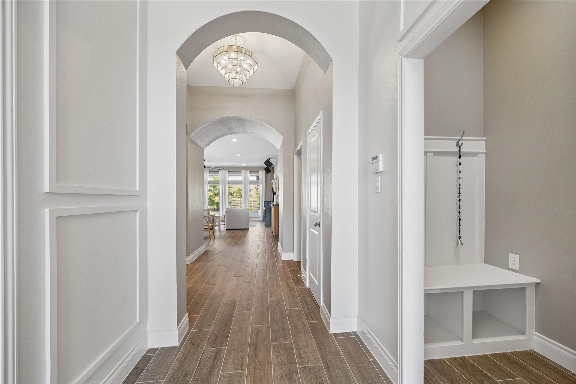 The custom woodwork in the entryway complete with the drop zone off of the garage are just two more thoughtful details showcasing pride of ownership in this stunning home.
