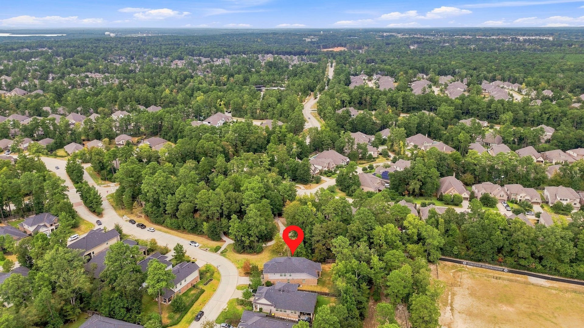 Nestled within a lush, wooded neighborhood, this home offers serene privacy and a spacious setting, ideal for those seeking tranquility while still being part of a vibrant community.
