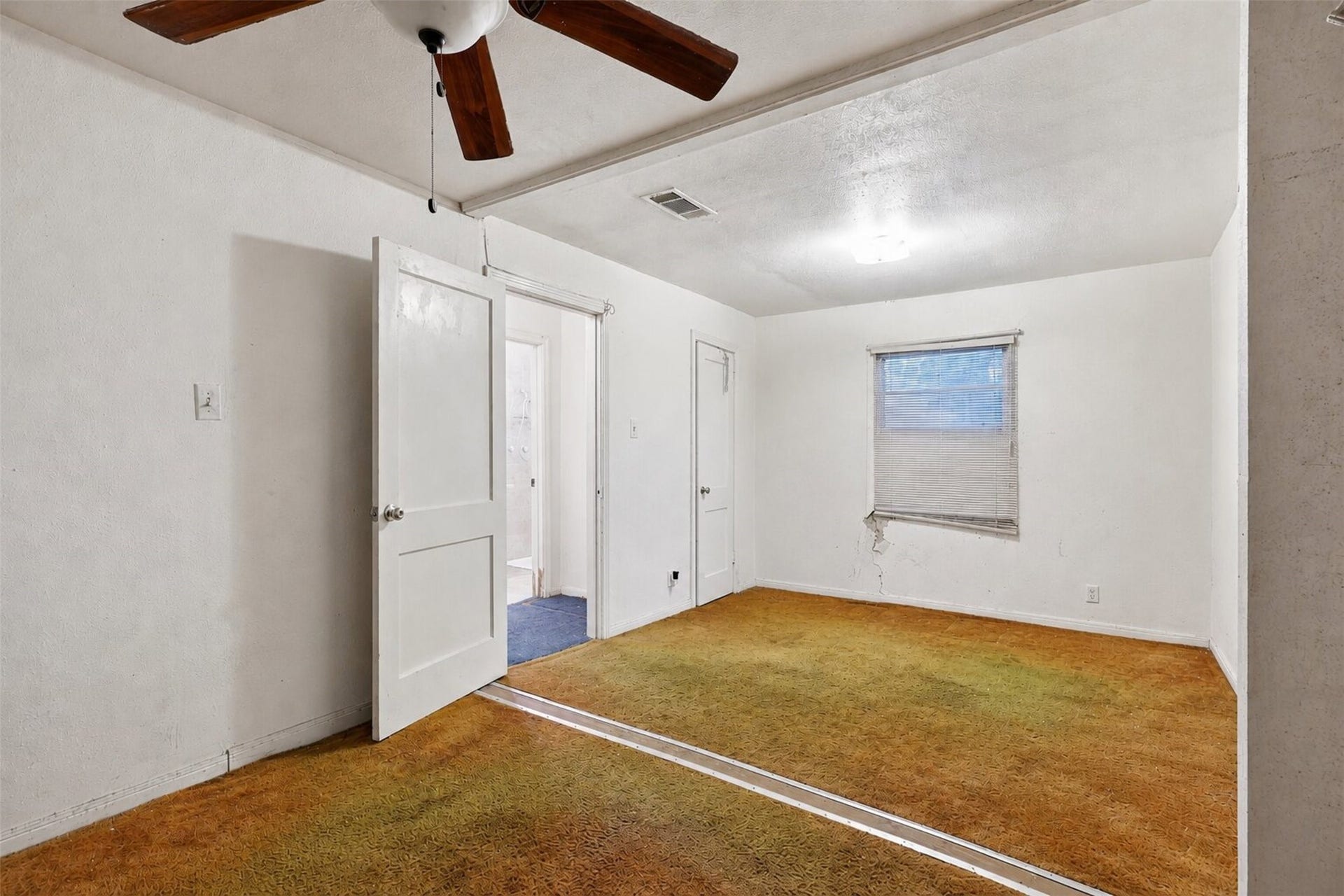 This room offers flexibility for a cozy bedroom, guest space, or home office setup