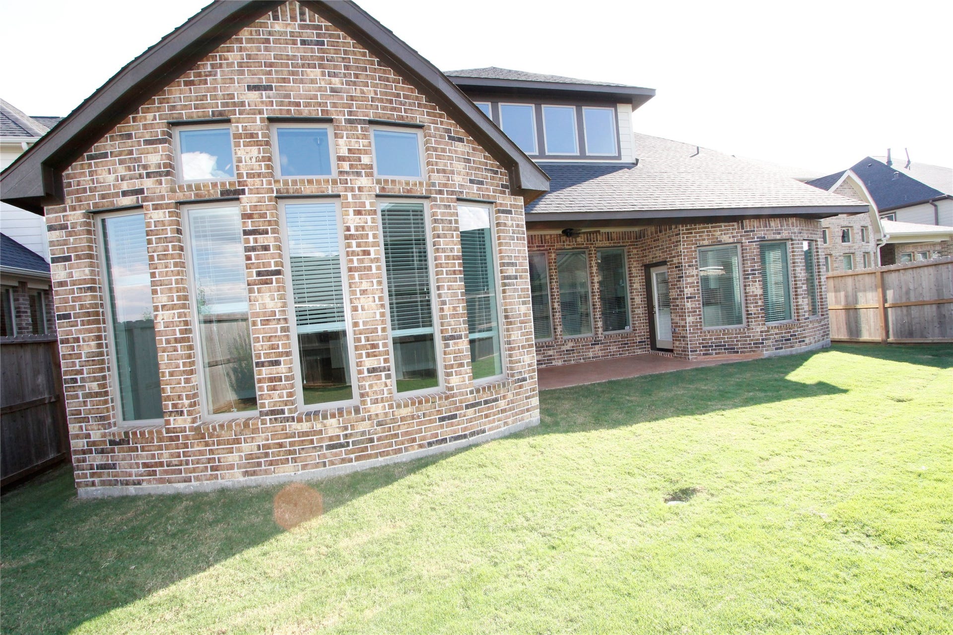 906 Daffodil View Court Court, Richmond, TX 77406 Back patio for relaxation and back view of the house