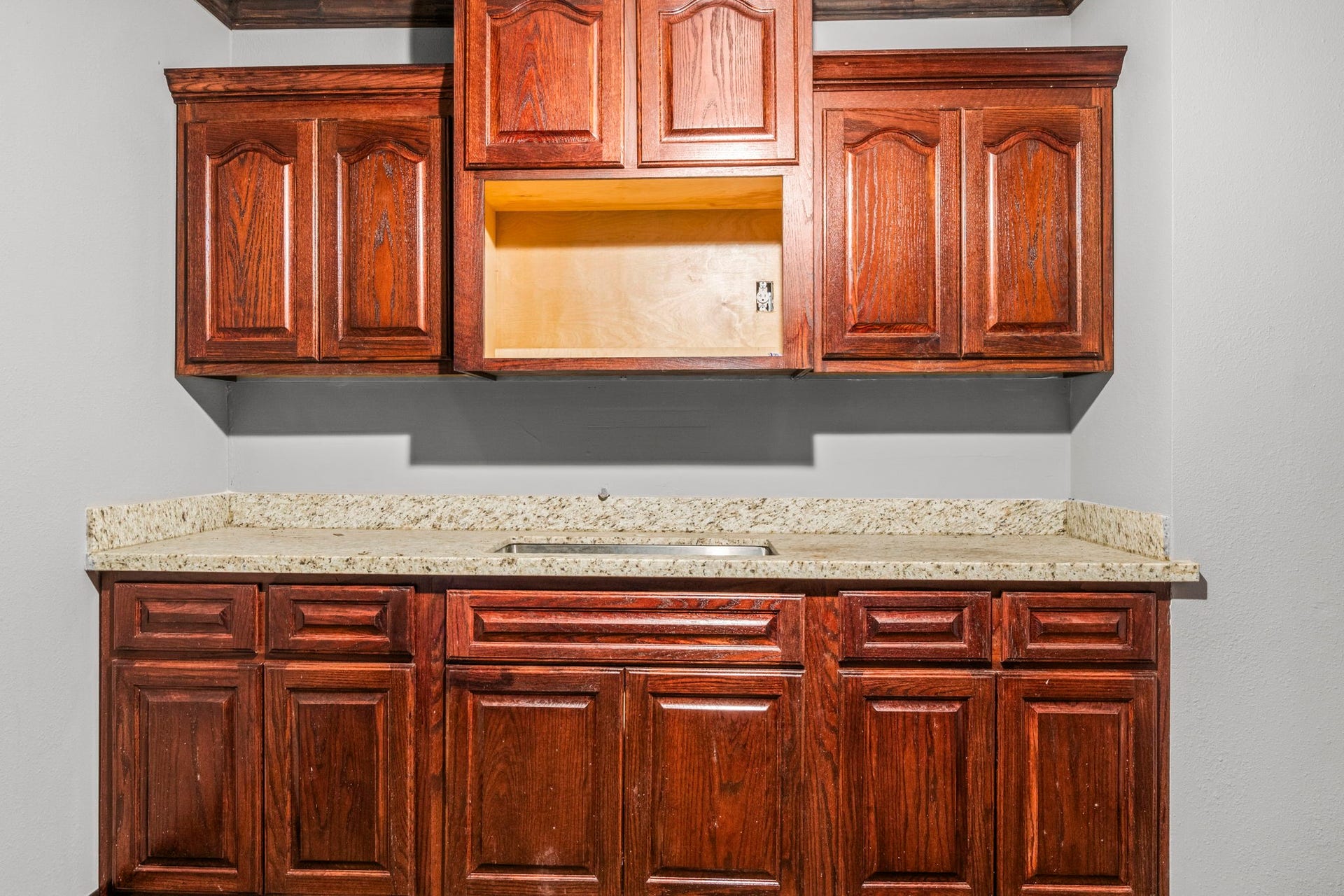 1018 Shaver Street, Pasadena, TX 77506 Built-in cabinetry with granite countersperfect for storage or break-room use.