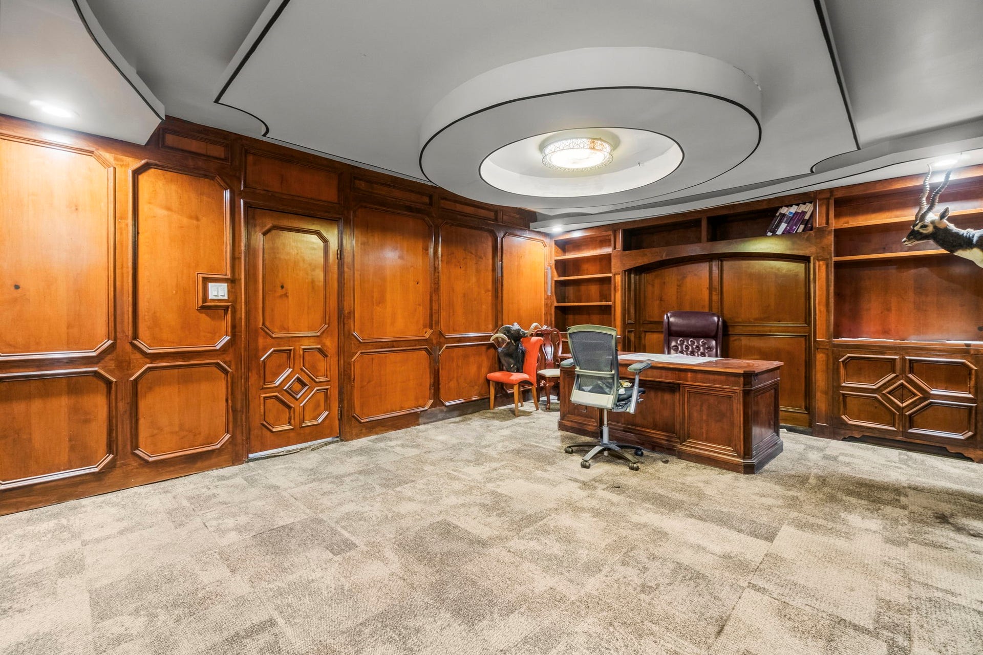 1018 Shaver Street, Pasadena, TX 77506 Spacious office area featuring decorative ceiling detail and rich wood finishes.