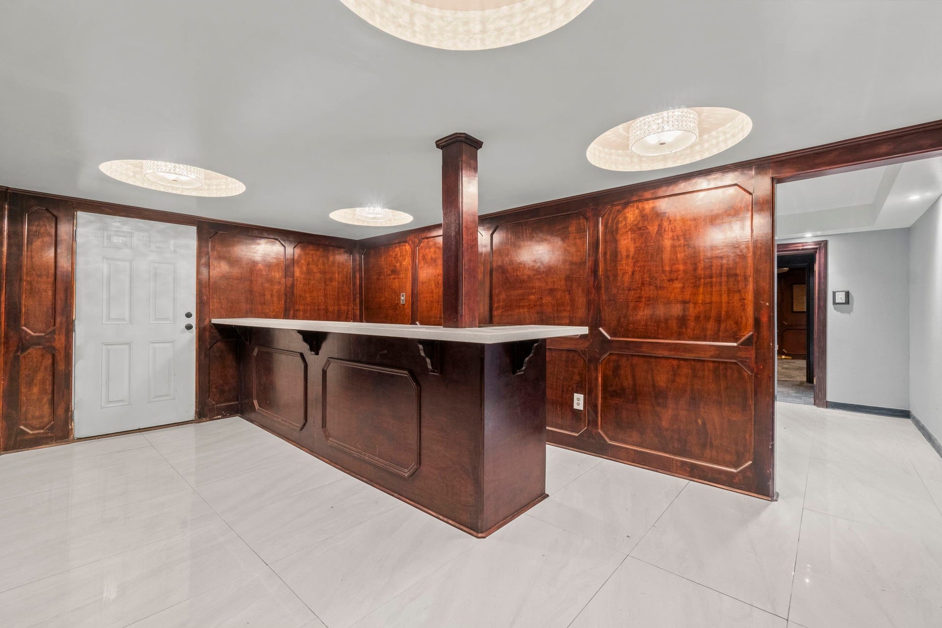 1018 Shaver Street, Pasadena, TX 77506 Multi-use reception counter area with polished wood paneling.