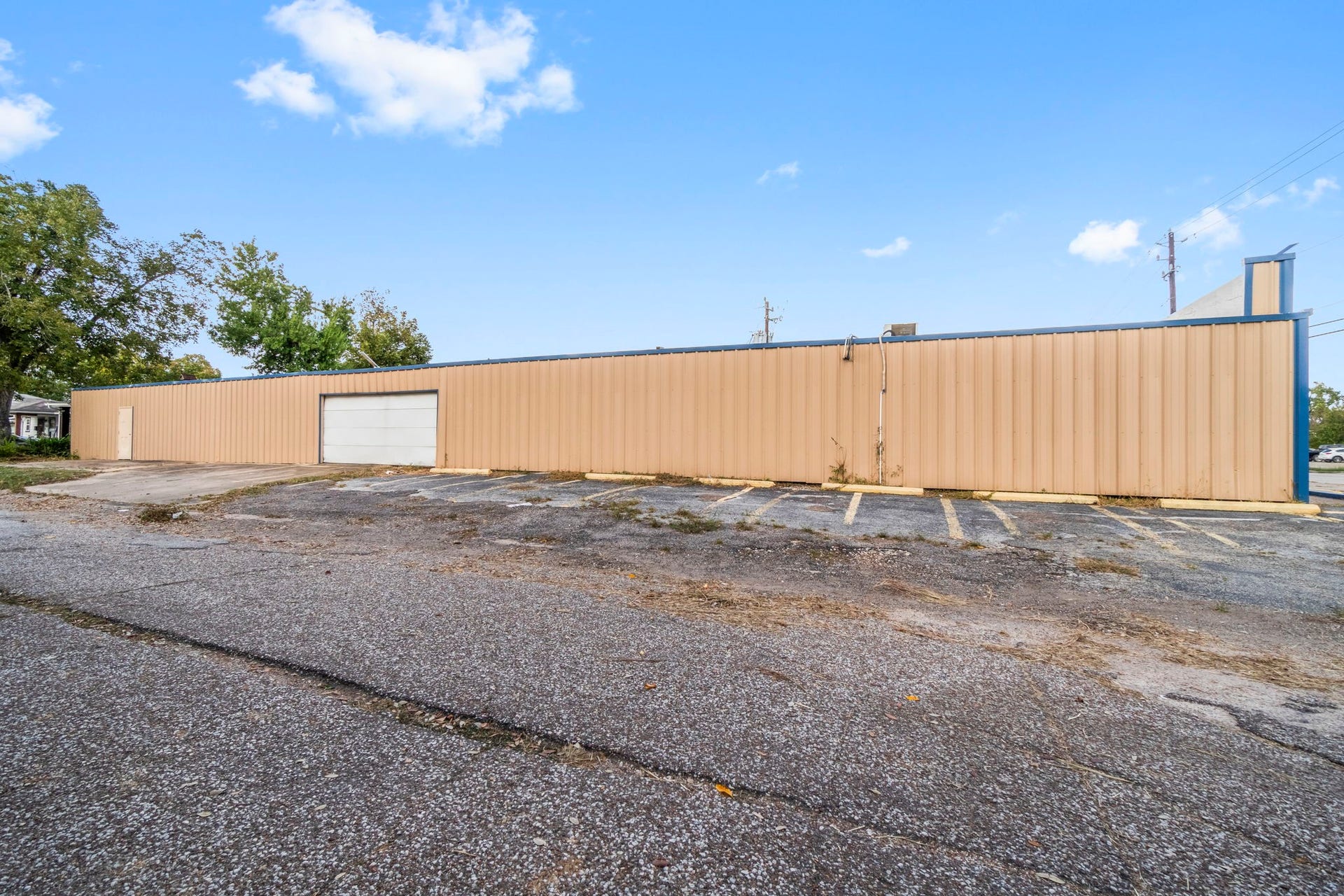 1018 Shaver Street, Pasadena, TX 77506 Rear elevation with wide driveway and additional parking availability.