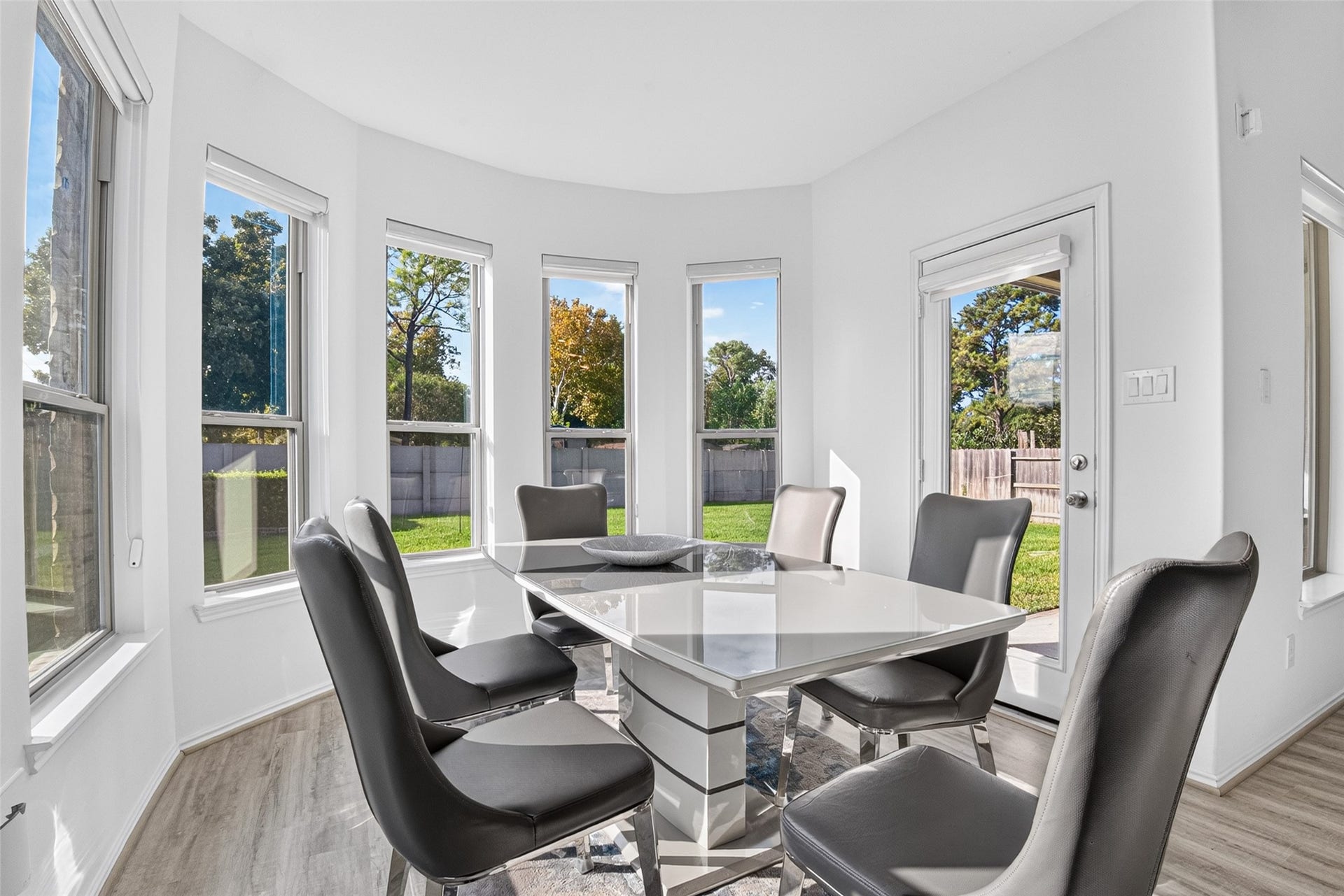 1315 Munson Valley Road, Richmond, TX 77406 Sun-filled dining space offering scenic views of the landscaped backyard.