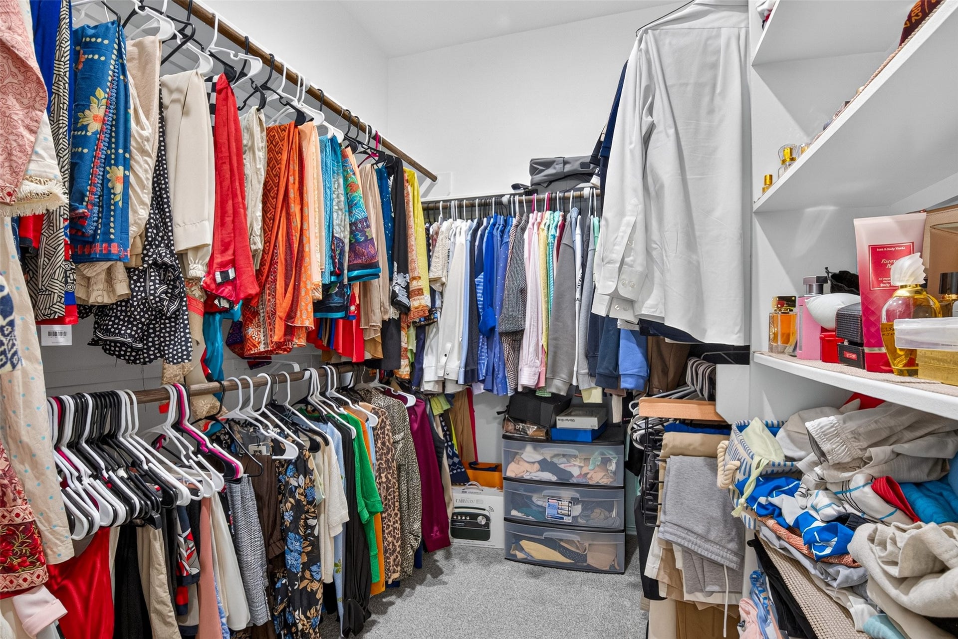 1315 Munson Valley Road, Richmond, TX 77406 Well-designed walk-in closet maximizes storage with hanging sections along multiple walls.