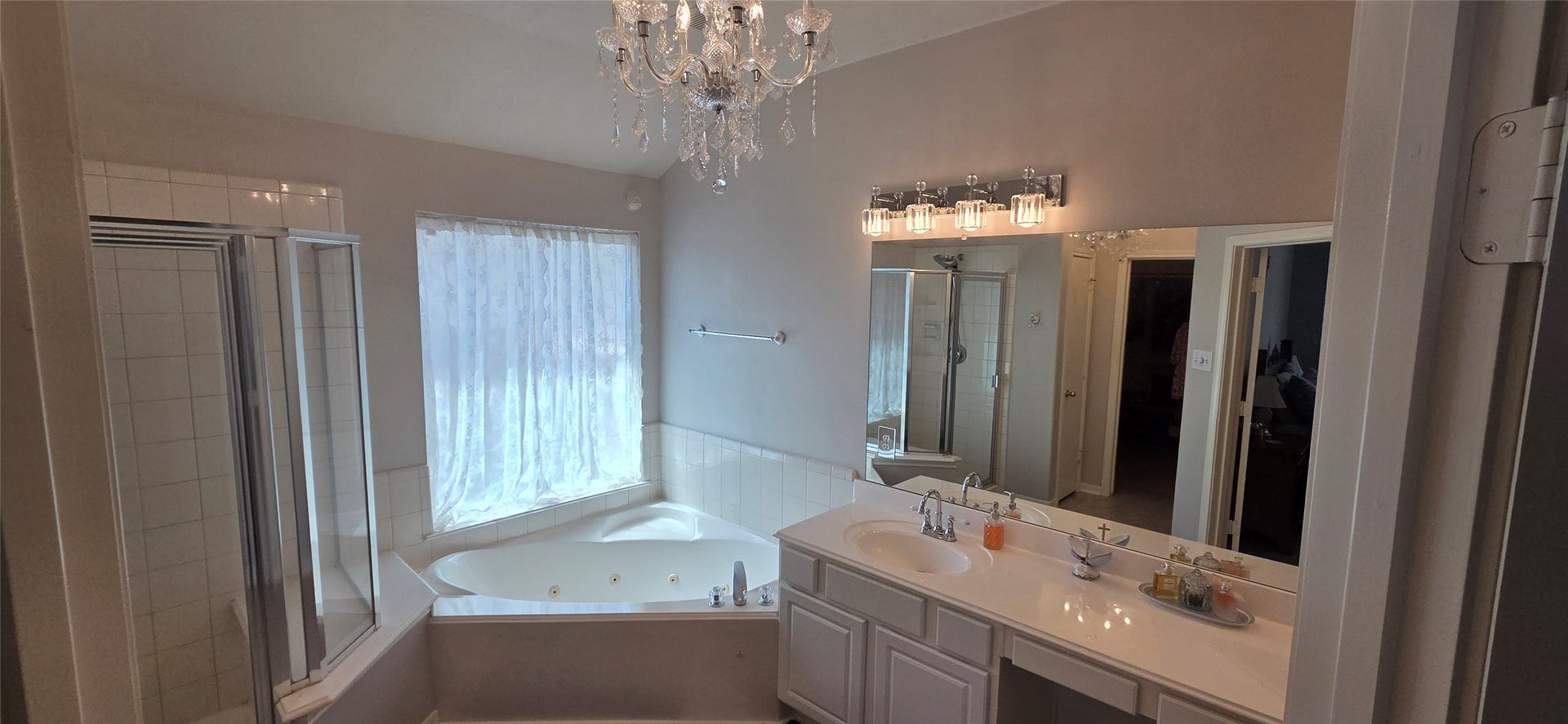 2406 Cardinal Elm Street, Fresno, TX 77545 Primary Bath with Chandelier