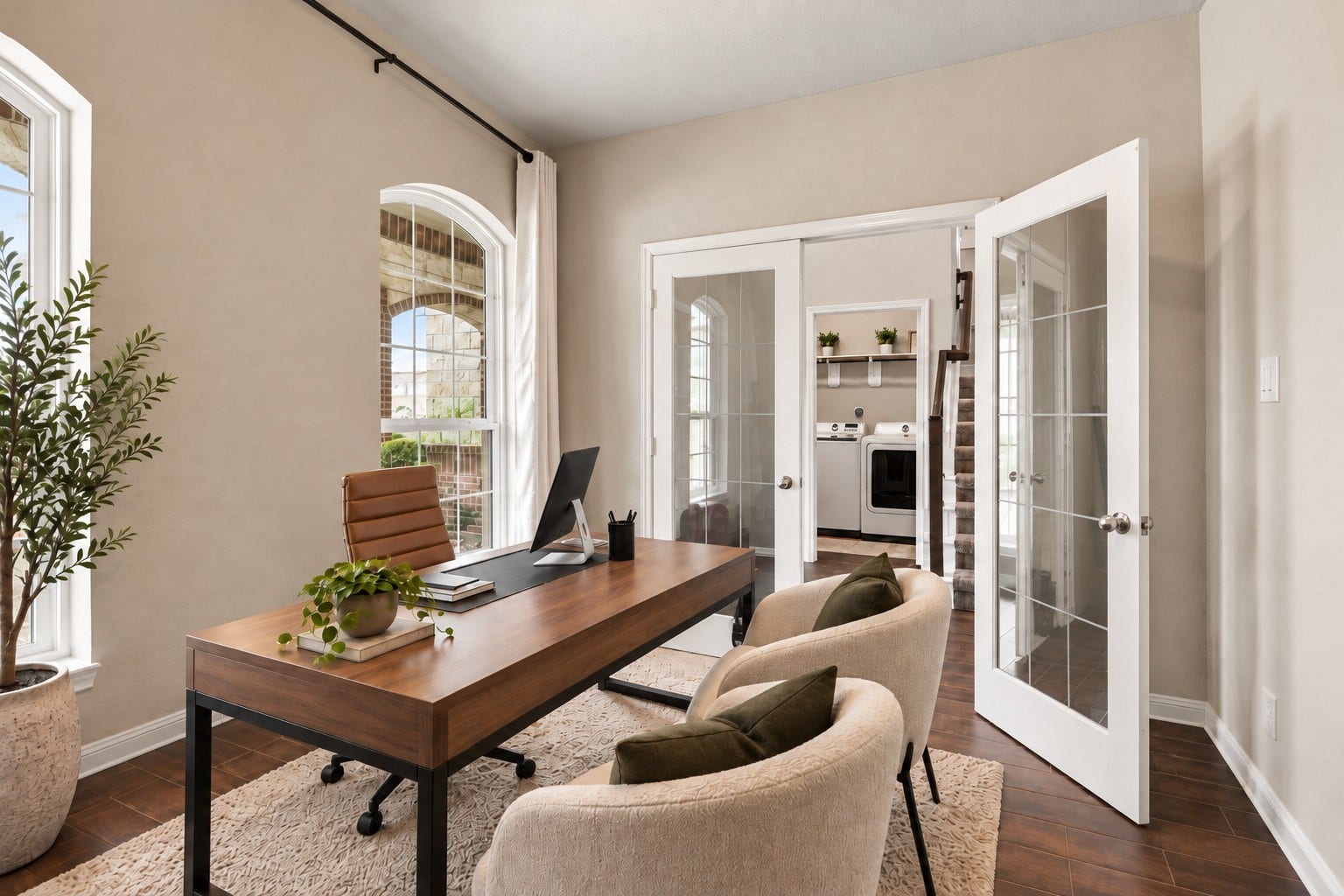 24115 Lake Molveno Drive, Katy, TX 77493 Virtually Staged: Captured from a reverse angle, this bright home office highlights elegant glass-paned double entryways that open onto the main foyer.