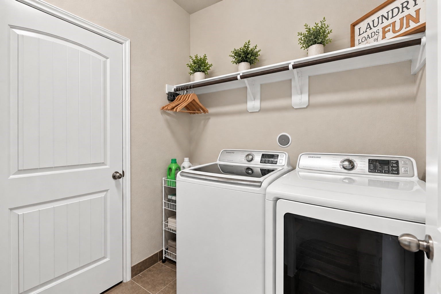 24115 Lake Molveno Drive, Katy, TX 77493 Virtually Cleaned: This highly functional laundry room features a side-by-side washer and dryer arrangement set over durable, low-maintenance tiled floors.