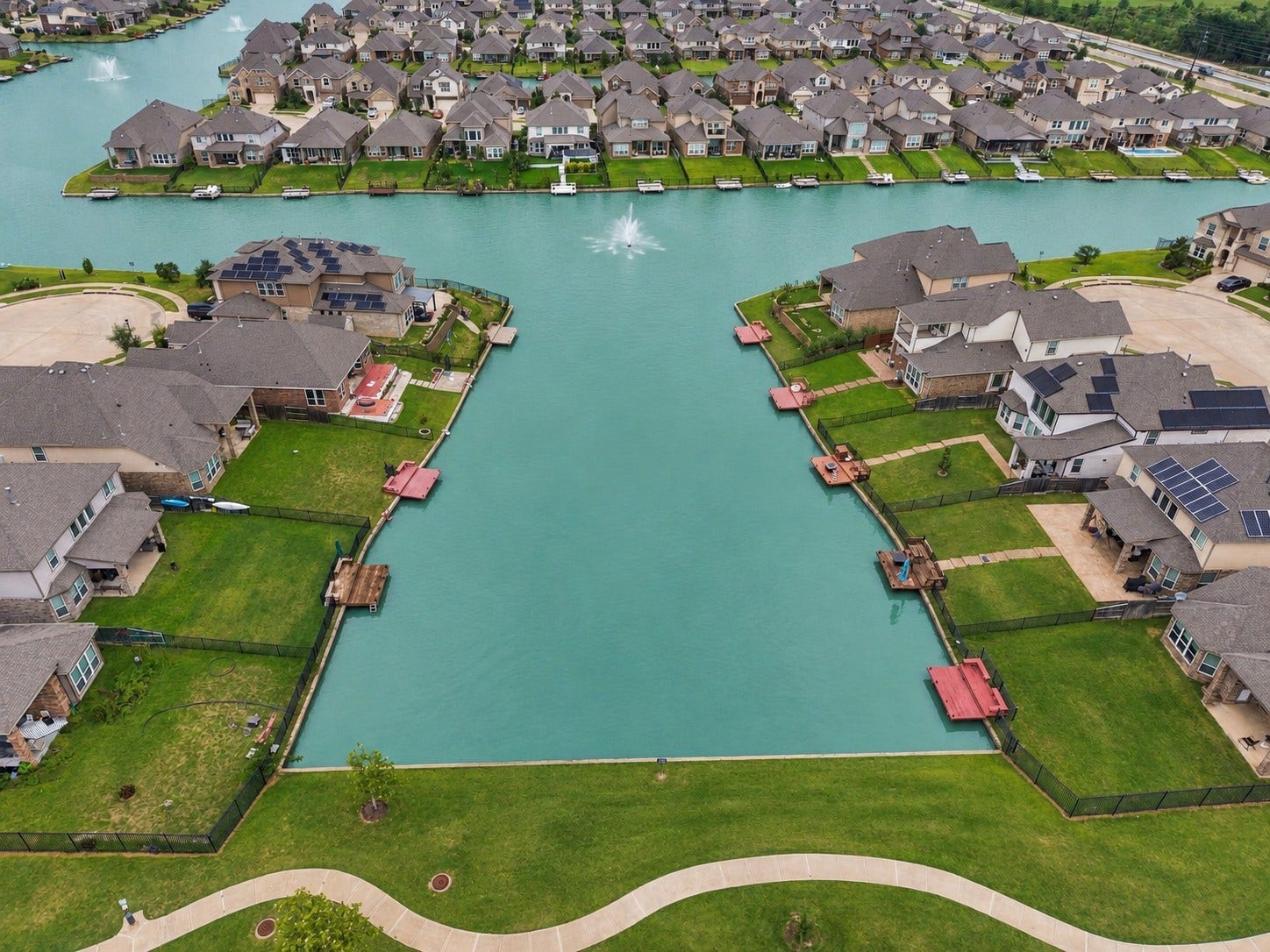 24115 Lake Molveno Drive, Katy, TX 77493 The surrounding community design offers private docks and waterfront vistas, highlighting an exceptional environment with prime location amenities.
