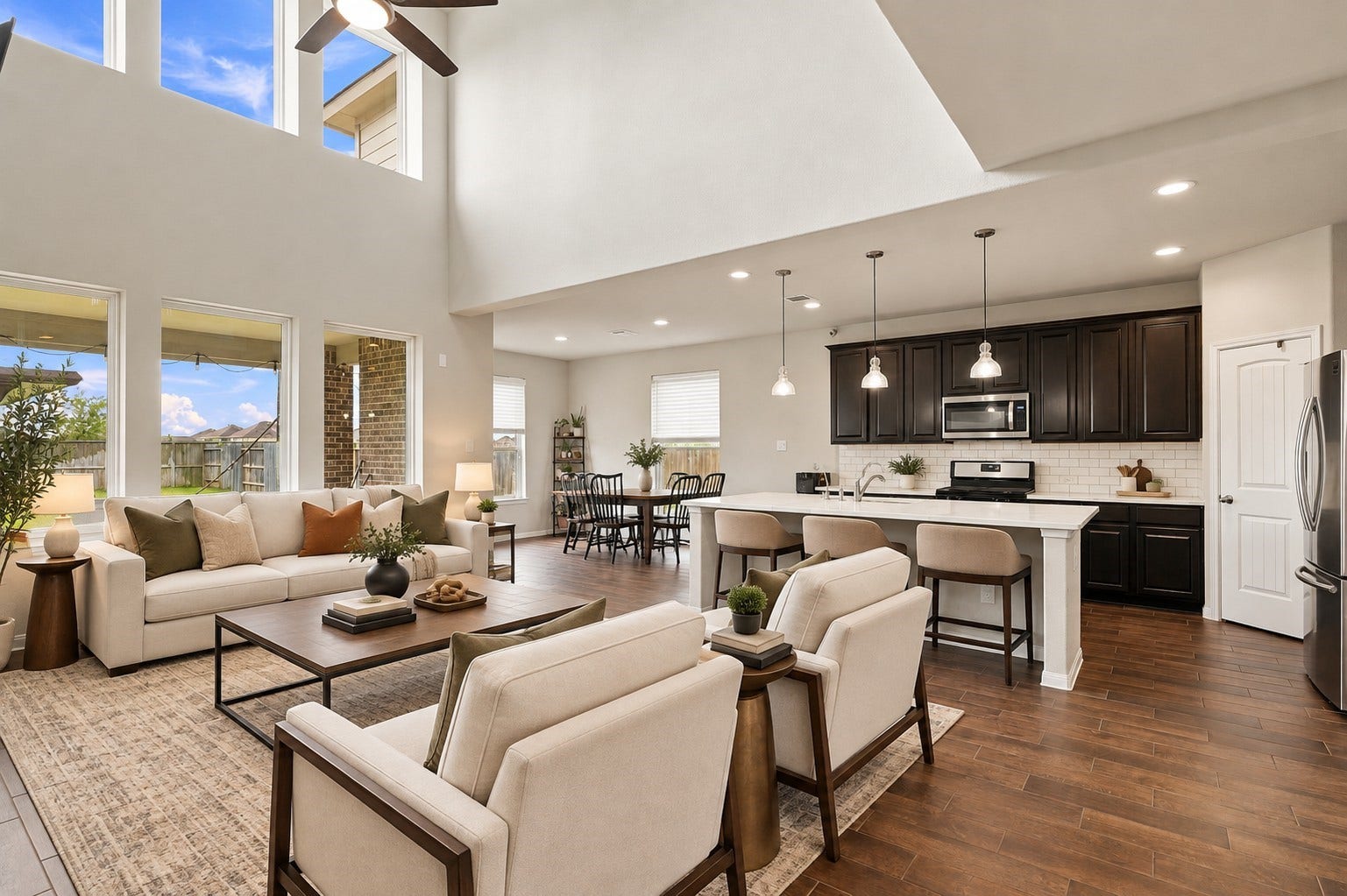 24115 Lake Molveno Drive, Katy, TX 77493 Virtually Staged: Emphasizing exceptional flow and broad floor space, this main-level great room brings together living, dining, and cooking zones in one cohesive environment.